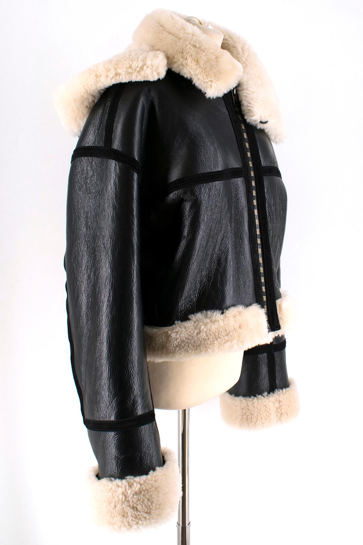Petar Petrov Shearling-lined Biker Jacket

Black and white lambskin and calf leather shearling-lined biker jacket
Gold and black hardware
Heavyweight 
Neck button closure
Suede detailing 
Removable hood
Fur collar 

Please note, these items are
