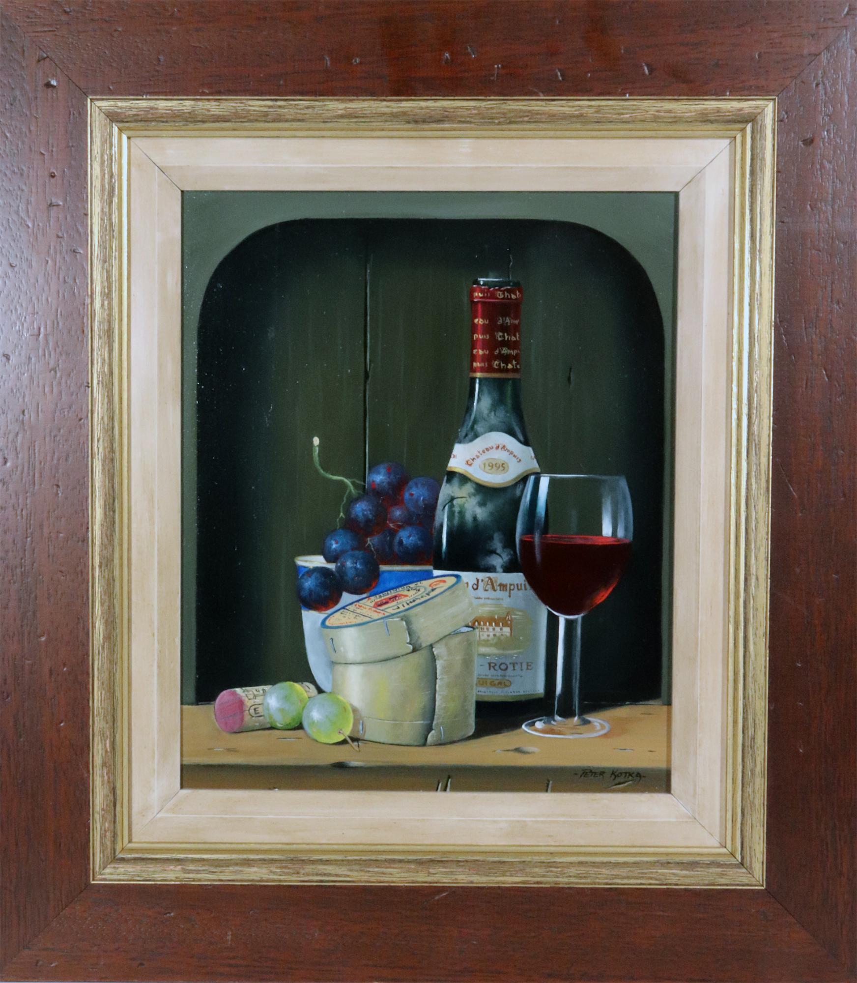 Peter A. Kotka Stiil Life with Wine & Cheese,
Oil on Linen Panel,
Signed lower right.
1995.

The trompe l'oeil still life of a bottle of wine, a half-empty wine glass and a small bunch of grapes in a small bowl with a round of French Cheese and
