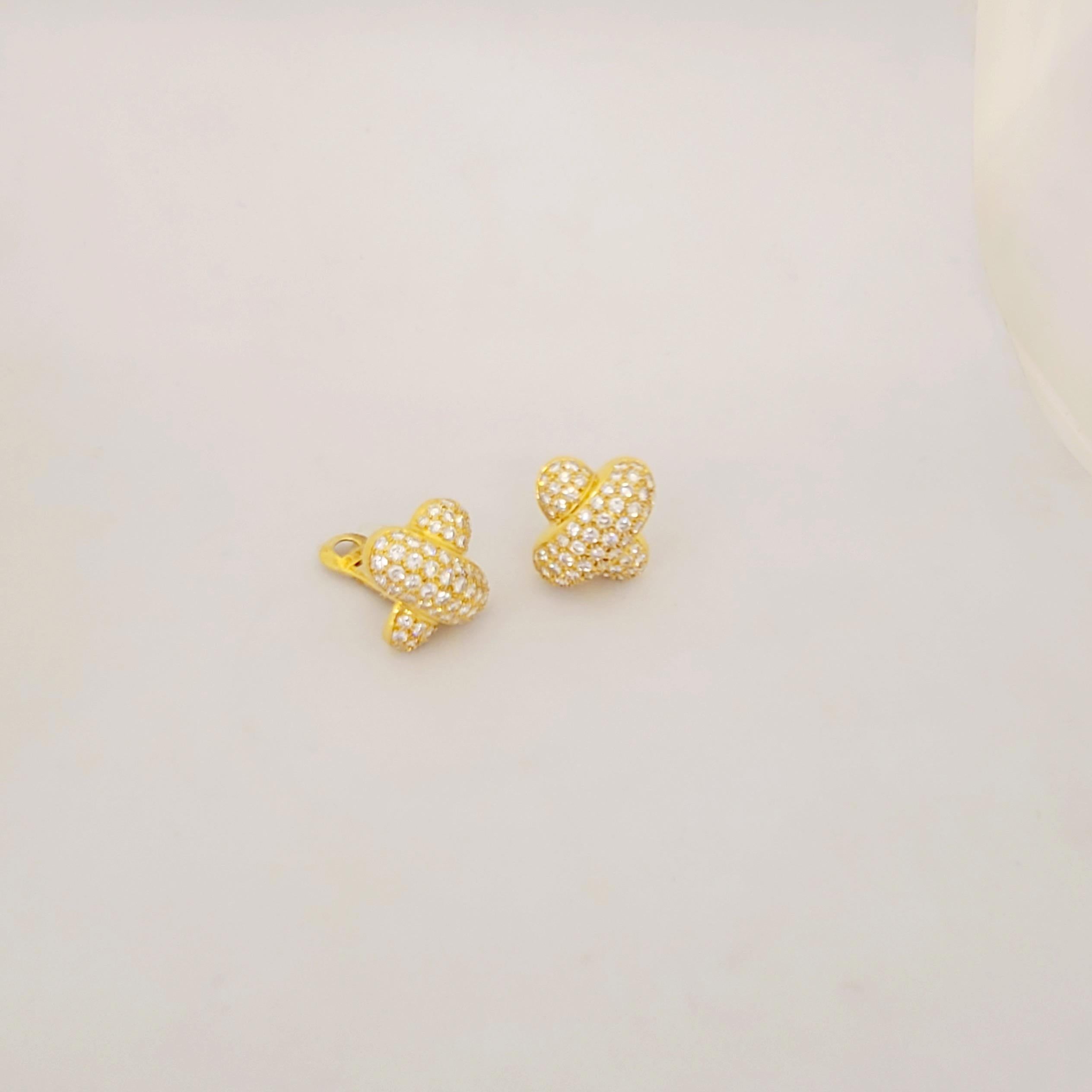 Peter Atman designed Earrings are set in 18KT Yellow Gold with 7.95Ct of Diamonds in an X shape. 
Earring measure .5