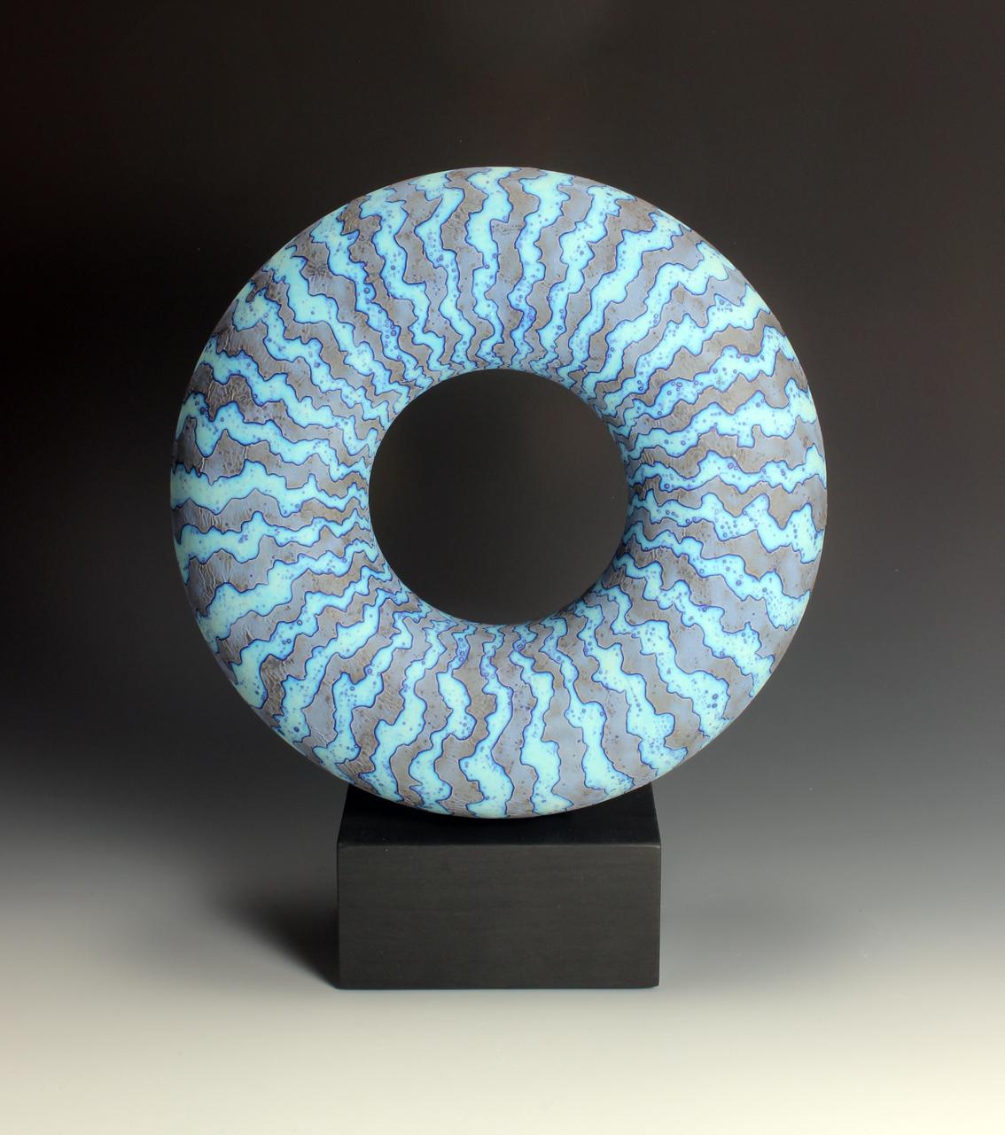 Peter beard. A large Earthenware Disc in a Cobalt Wax Resist Glaze mounted on Welsh Slate.

Measures: 41.5 cm high, 32 cm wide, 11cm deep.
 
2022
 
