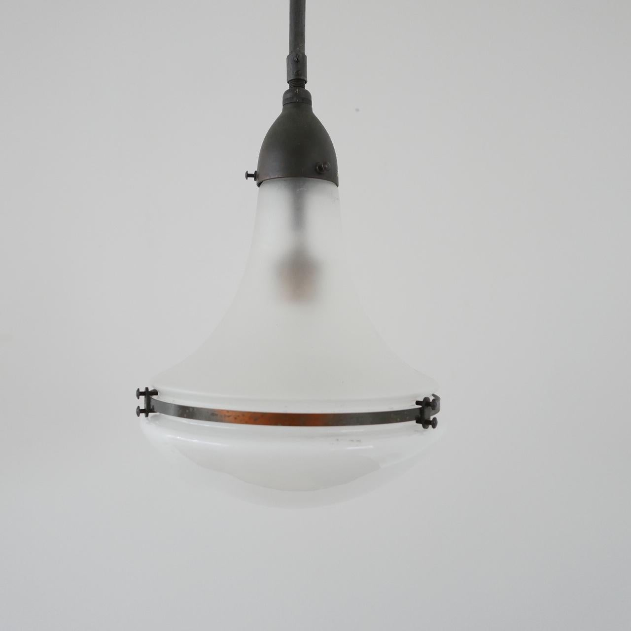 A rare Peter Behrens pendant light,

circa 1920s, for Siemens, Germany. 

Bauhaus era. The Smaller model. 

Original patinated gallery with stem and original ceiling rose. 

The stem can be cut down by any electrician or we can arrange to do