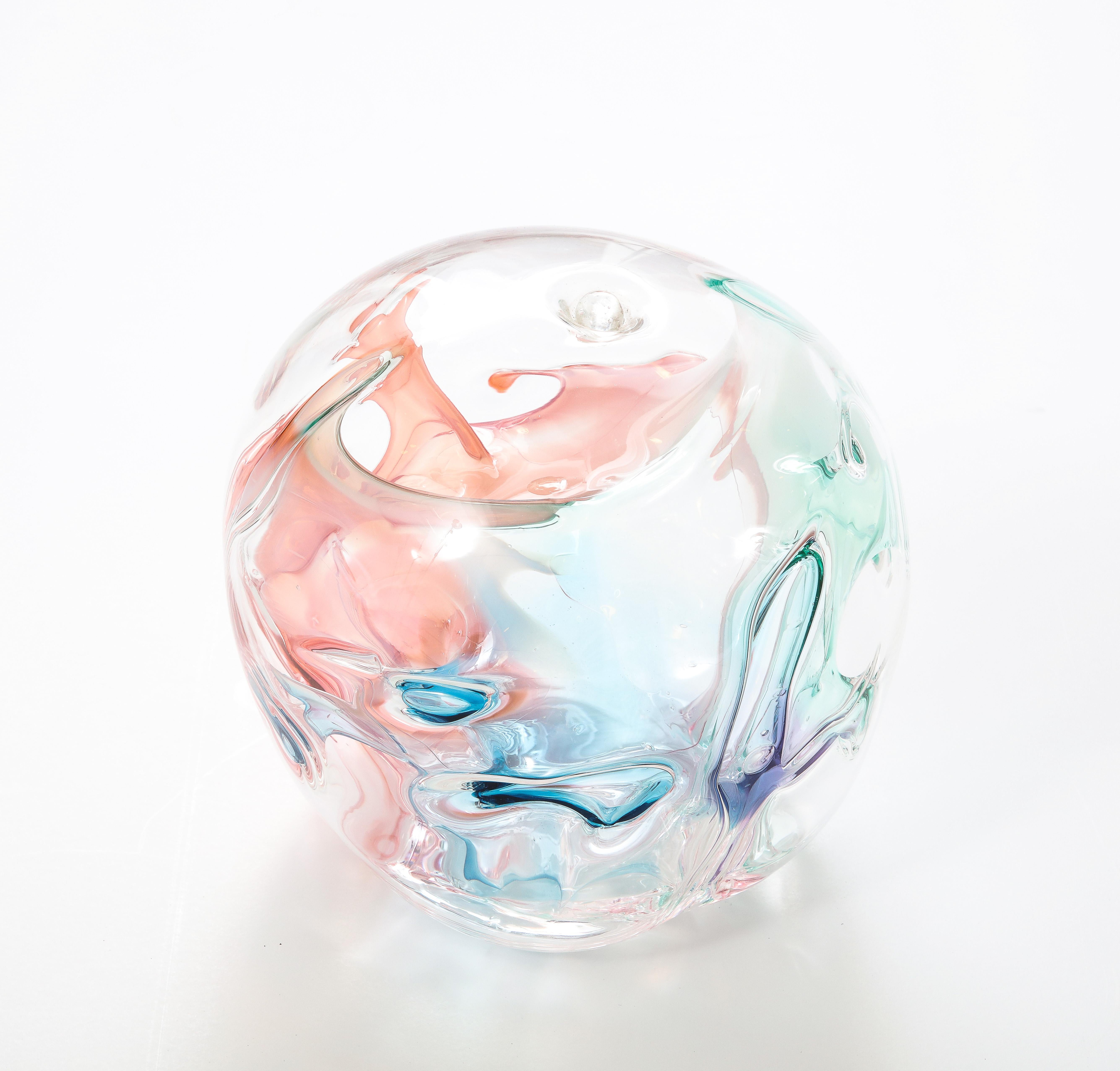 Peter Bramhall clear glass orb sculpture with internal glass threads in
pastel shades of Blue, Pink and Green.
The piece is signed and dated on the bottom.