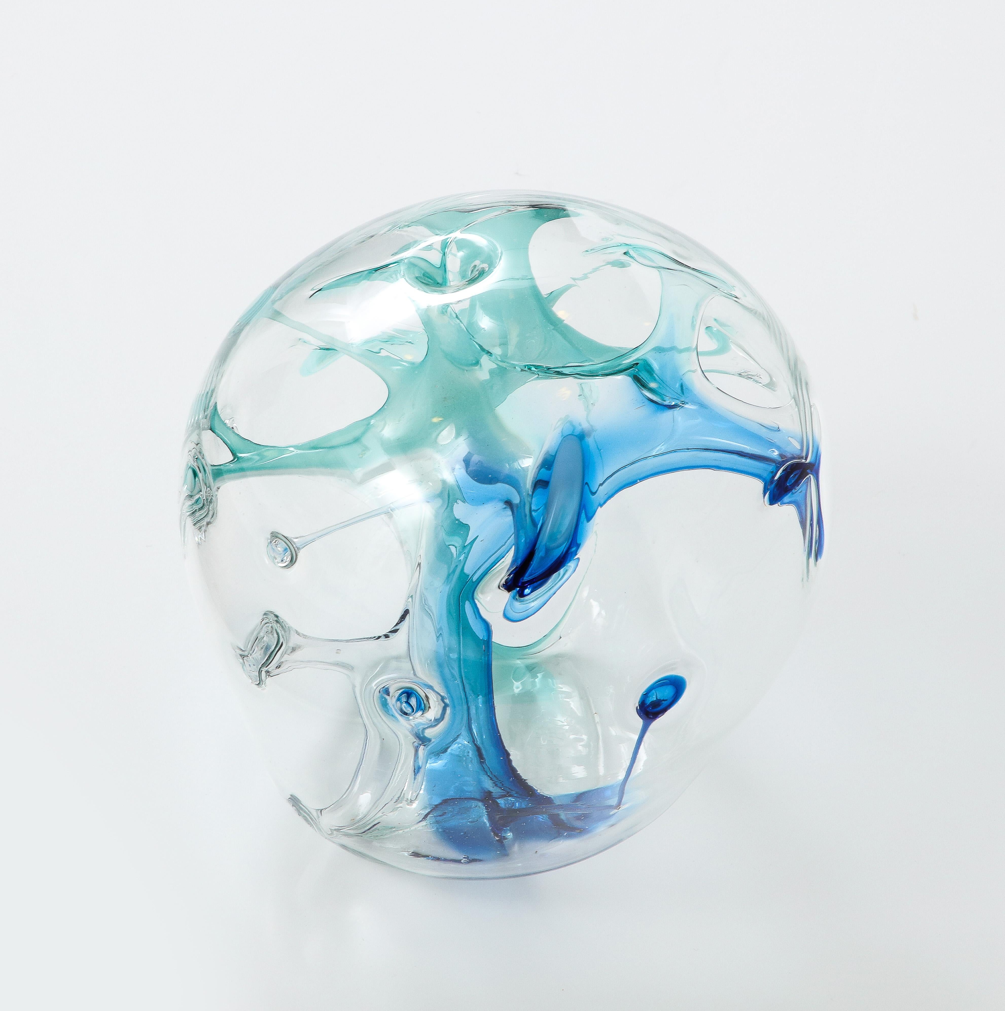 Peter Bramhall glass Orb sculpture signed and dated.
The clear glass orb has internal glass threads in aqua and blue tones.