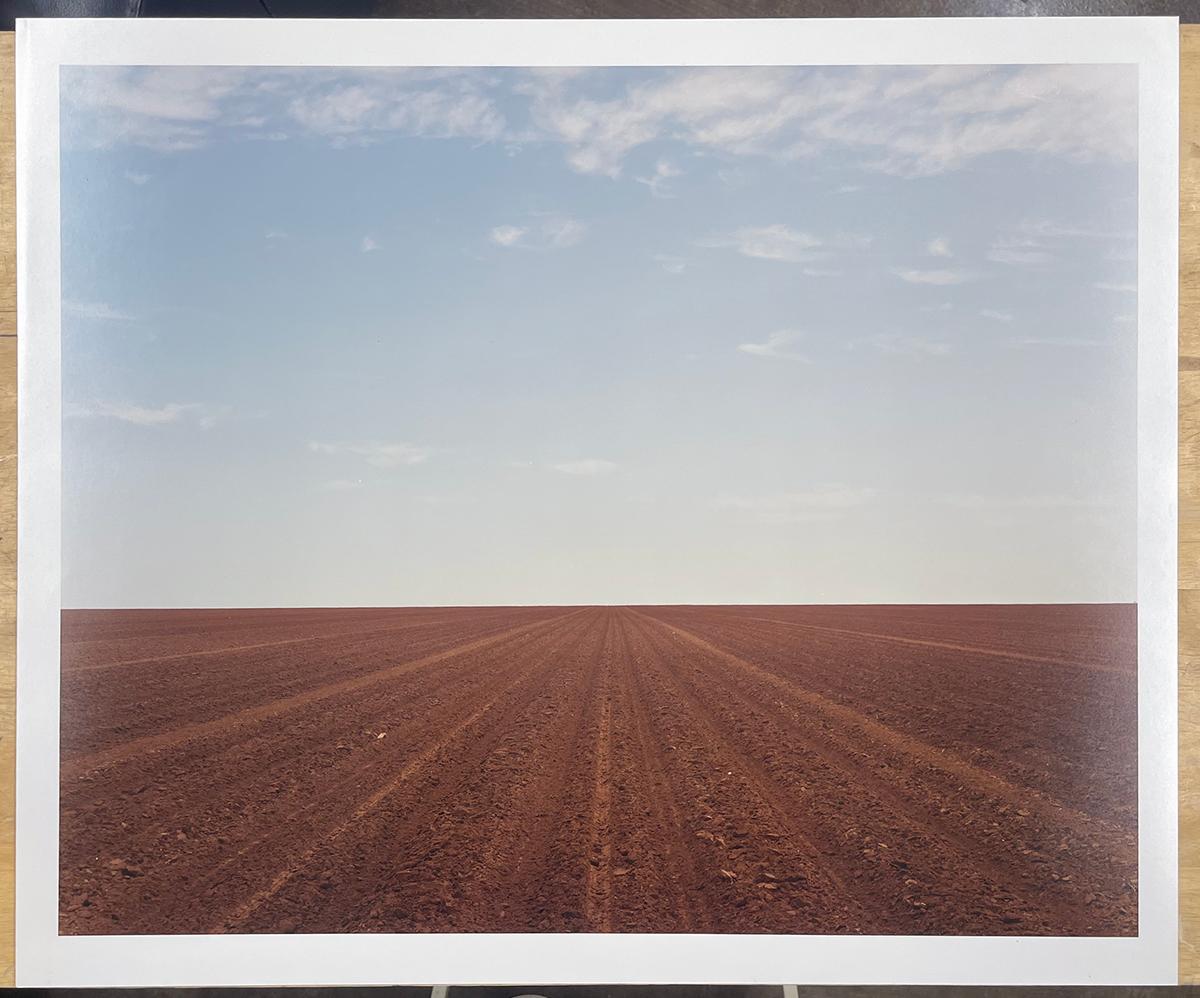 Levelland, TX - Plowed field, dirt, farm, landscape, minimal, horizon - Photograph by Peter Brown