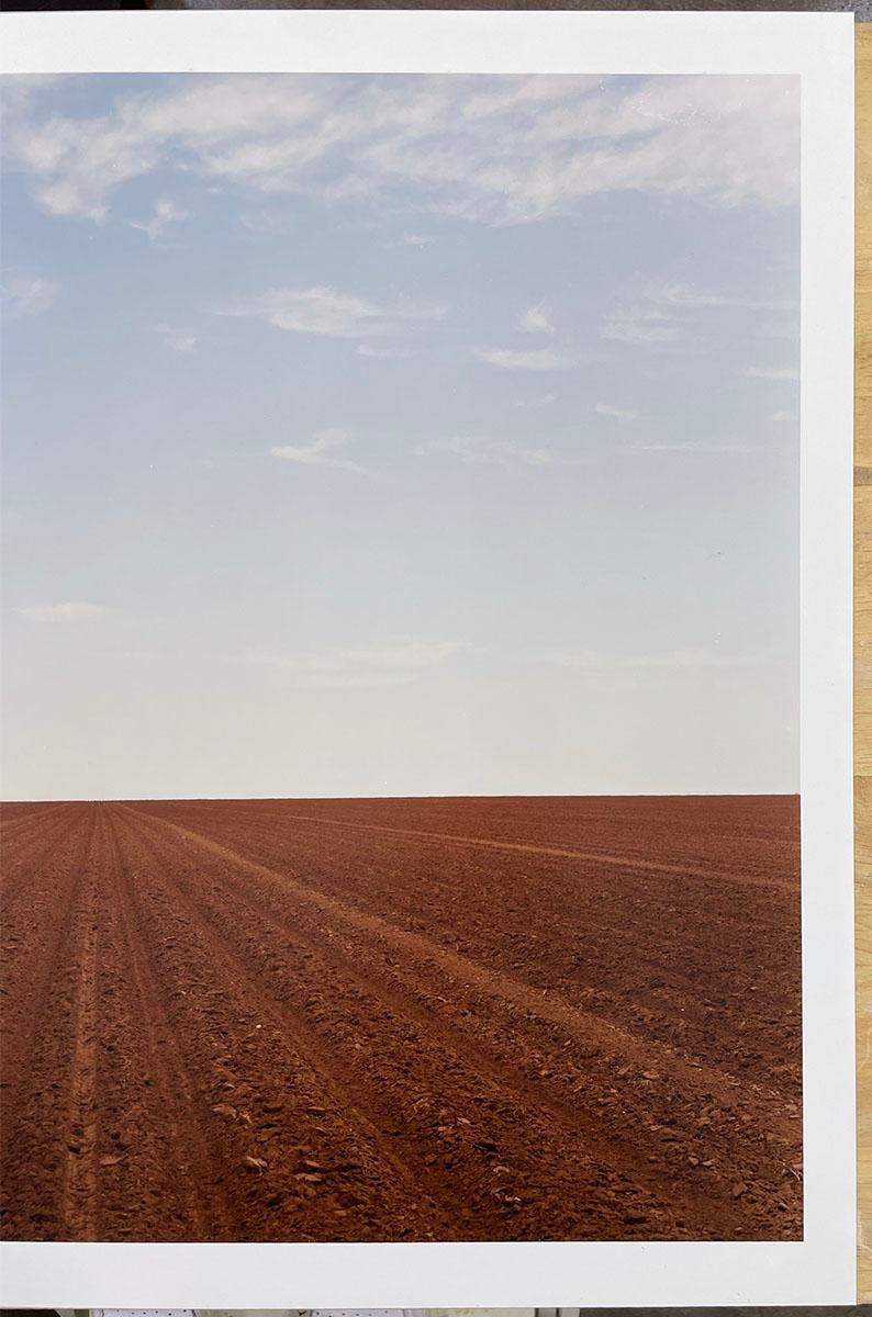 Levelland, TX - Plowed field, dirt, farm, landscape, minimal, horizon - Gray Color Photograph by Peter Brown