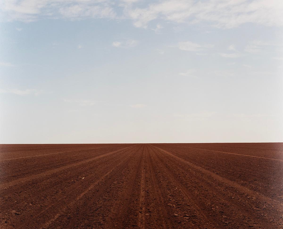 Peter Brown Color Photograph - Levelland, TX - Plowed field, dirt, farm, landscape, minimal, horizon