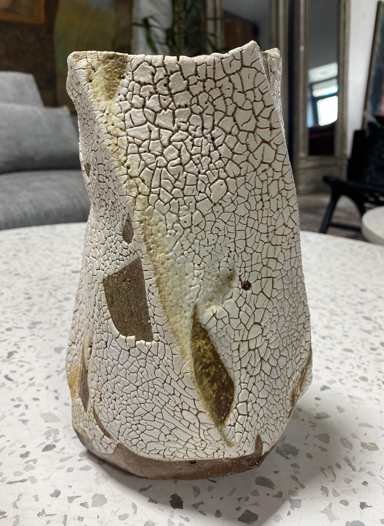 A fabulous wood-fired twisted sculptural form Mentori series vase/ vessel by master East Coast studio potter Peter Callas. For 23 years Callas partnered with the esteemed fellow American clay artist Peter Voulkos at his New Jersey kiln producing