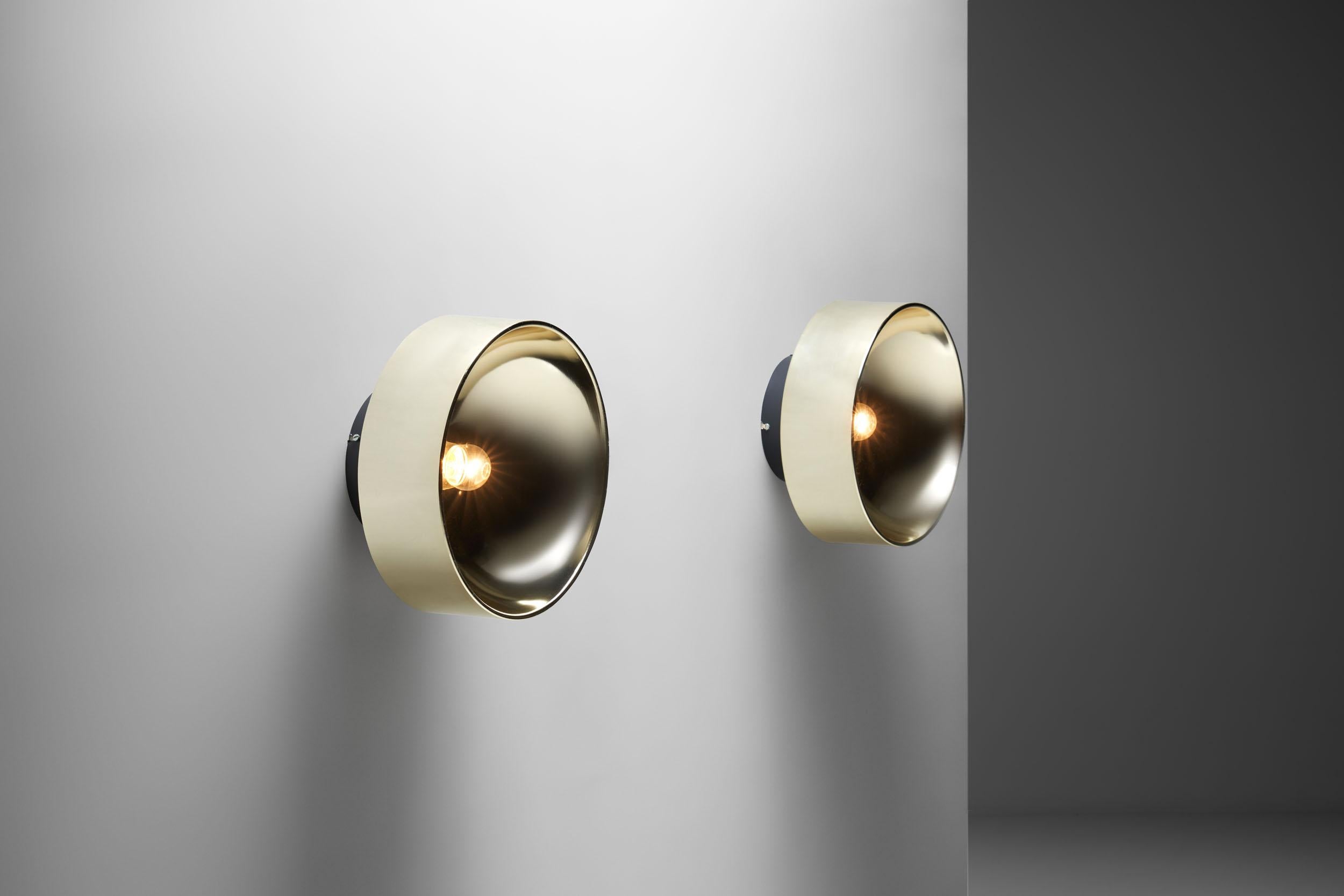 This pair of Peter Celsing wall sconces are celebrated for their iconic design, bringing modernity into any setting. Being a visual representation of “Svensk design”, this model projects a powerful, concrete rendering of a sort of essentialized