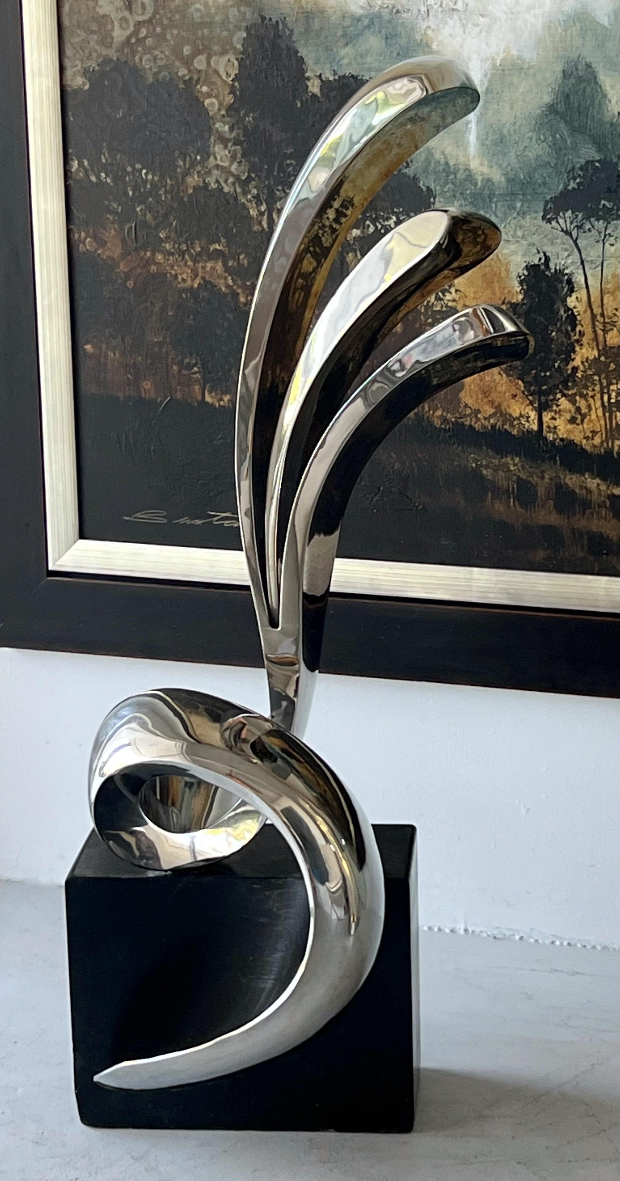 A large polished stainless steel sculpture by Peter Chinni. Signed, dated a numbered 1/8