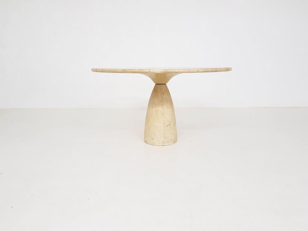 Peter Draenert “Finale 1790” round solid travertine dining table for Draenert, Germany, 1970s.

This very heavy dining table, designed by German Architect Peter Draernert, features a thick (3 cm / 1,18 in) solid round top on a solid sculptural