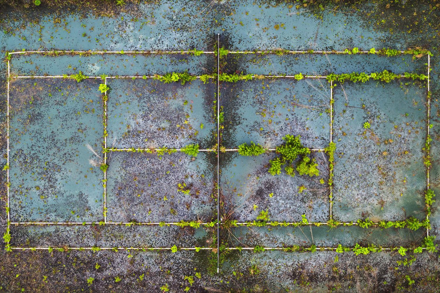 Peter Essick Abstract Photograph - "Abandoned Tennis Court, Snellville, GA" - drone photography, color, tennis