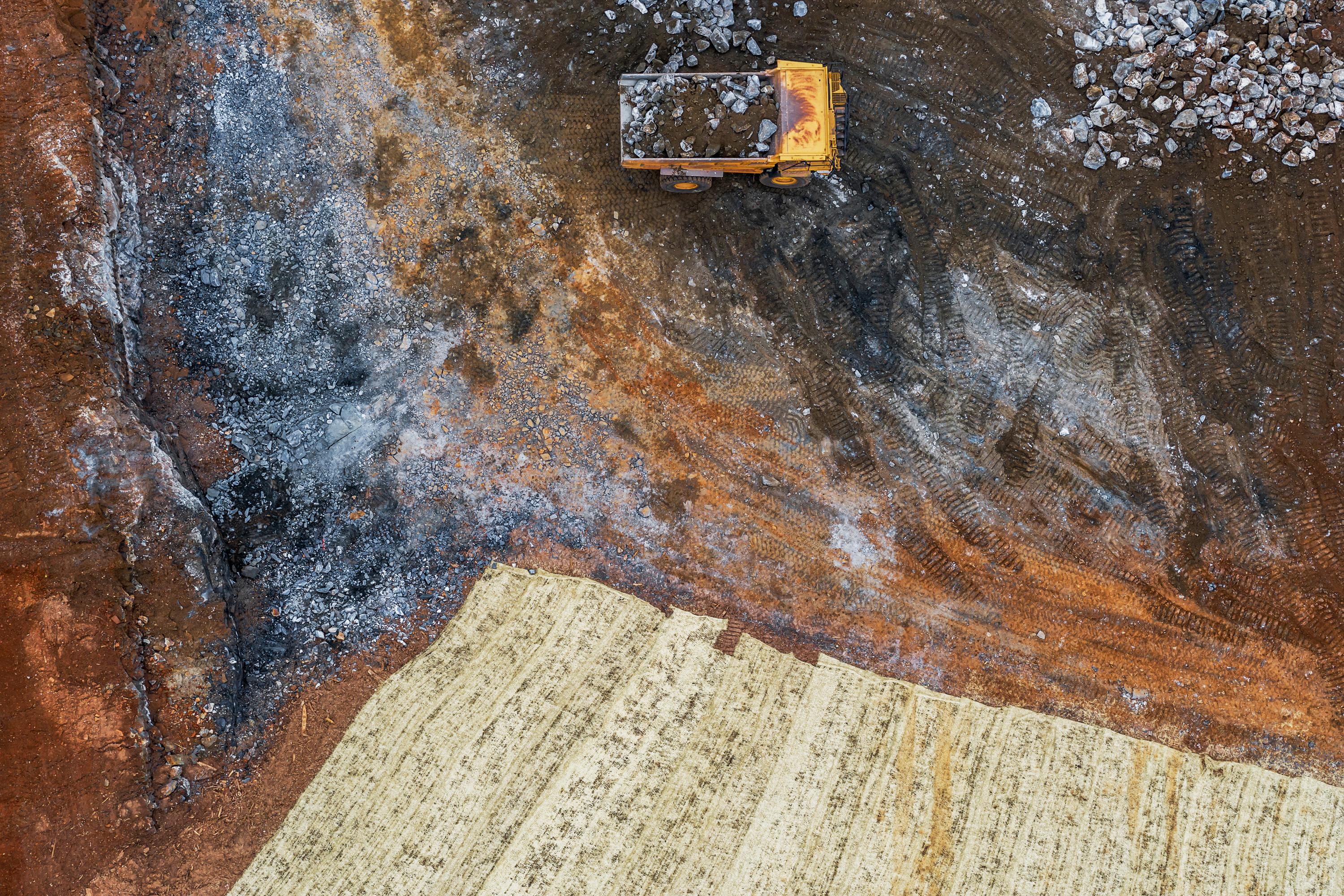 "Construction Site, Snellville, Georgia #5, 2019" is a drone photograph featuring hues of orange, black, white and grey. Edition of 5. This photograph may be available in additional sizes. Peter Essick is inspired by the work of Walker Evans, Ray