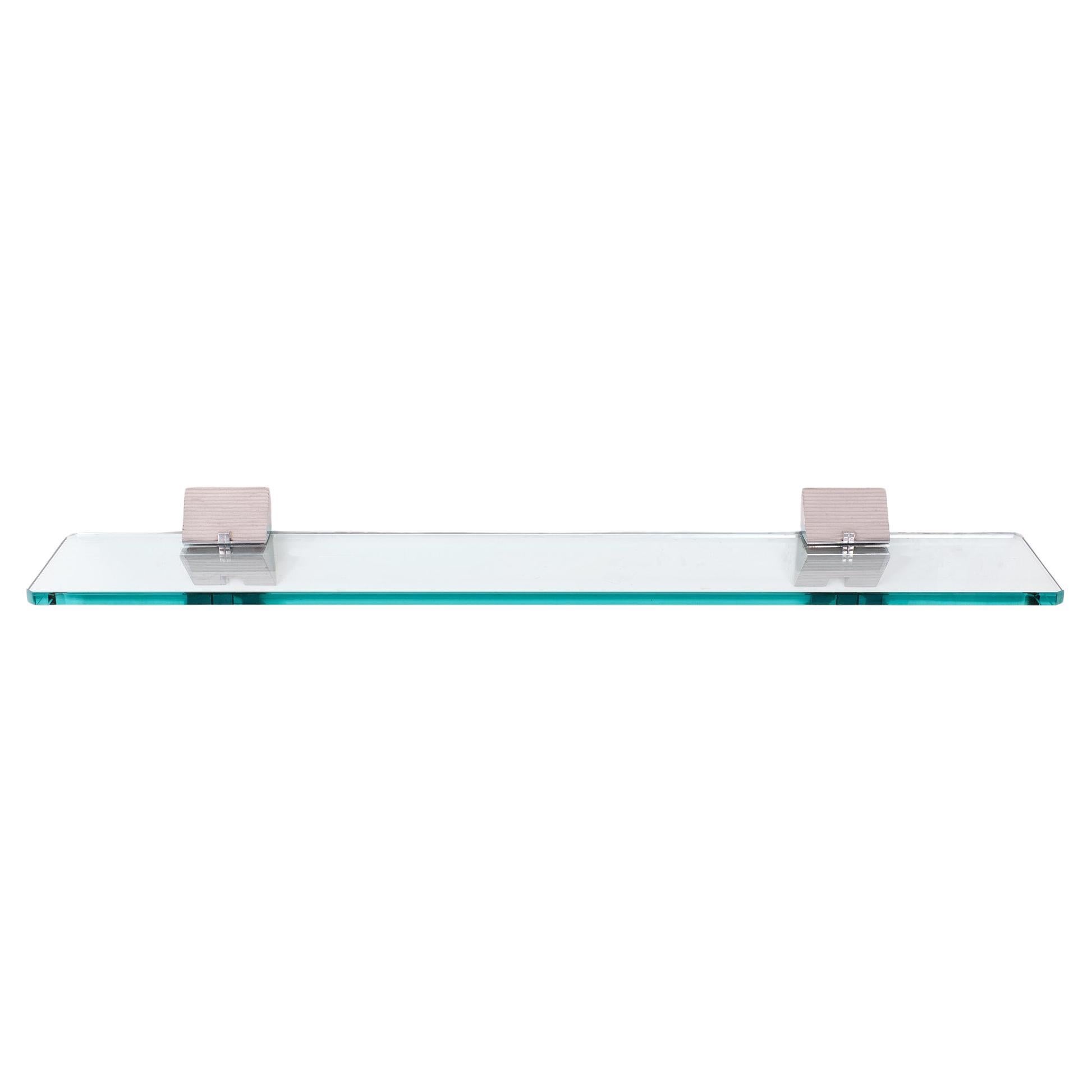 Very nice attractive wall shelve ''Planchet ''. Thick cut Glass shelve .greenish 
in color .holding by polished aluminum brackets .  
Design by Peter Ghyczy  1980s     