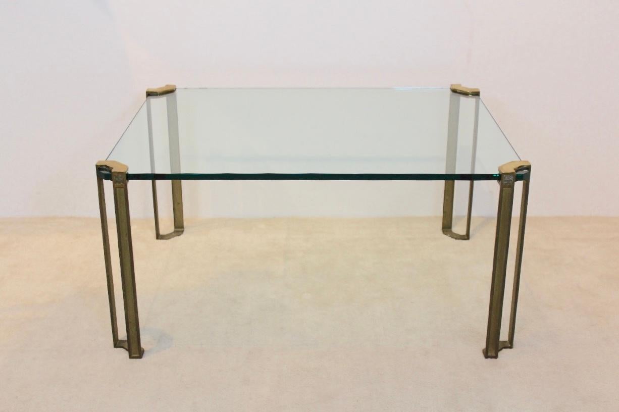 Wonderful and Minimalist brass and glass coffee table designed by Peter Ghyczy in the early 1970s in the Netherlands. Born in Budapest, Peter Ghyczy started his career as an architect in Germany and has been living in the Netherlands for many years.