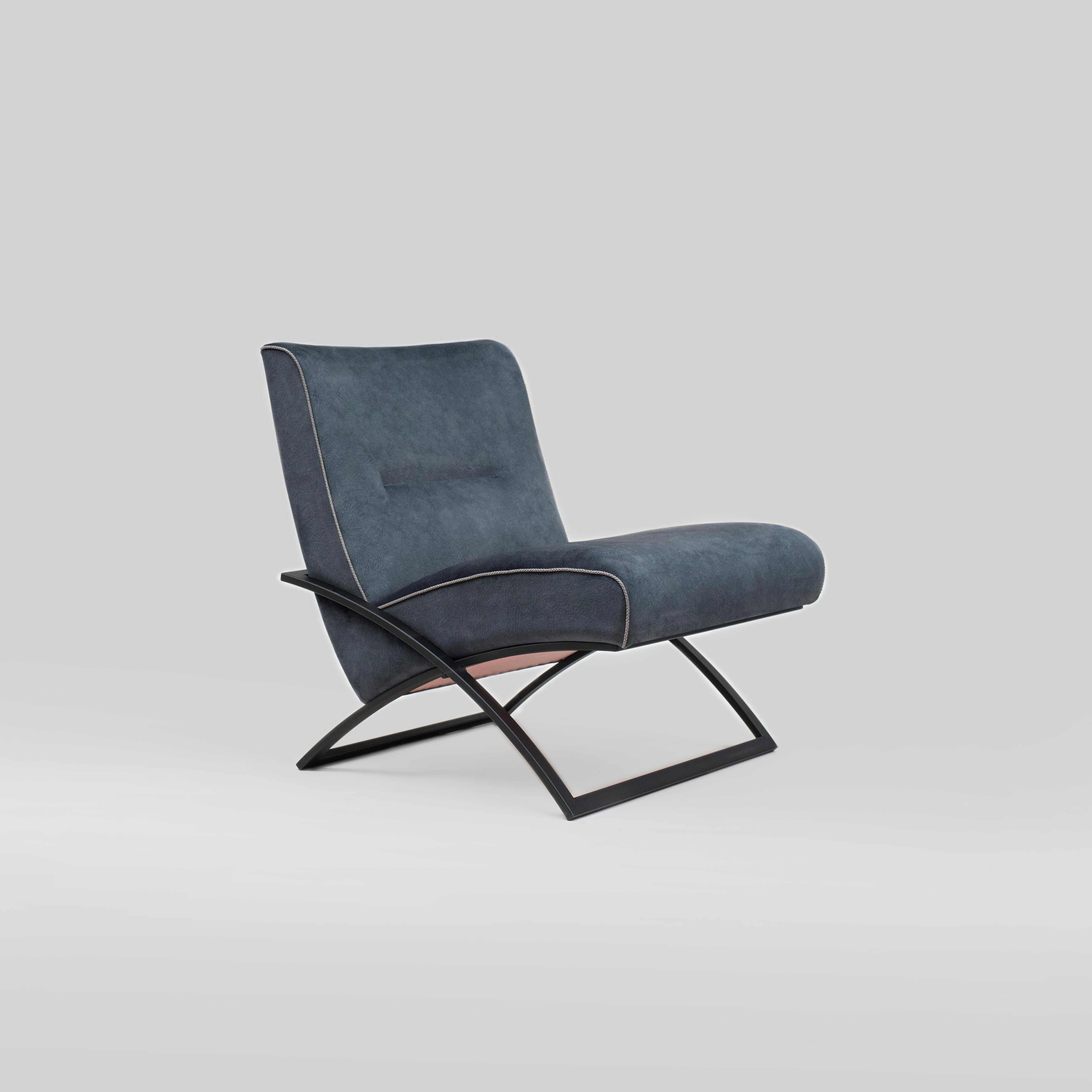 Armchair designed by Peter Ghyczy in 2016.
Manufactured by Ghyczy (Netherlands)

The construction of this chair is reduced to the minimum while keeping the comfort. The two curved intersecting frames support the upholstery. The form of the frame