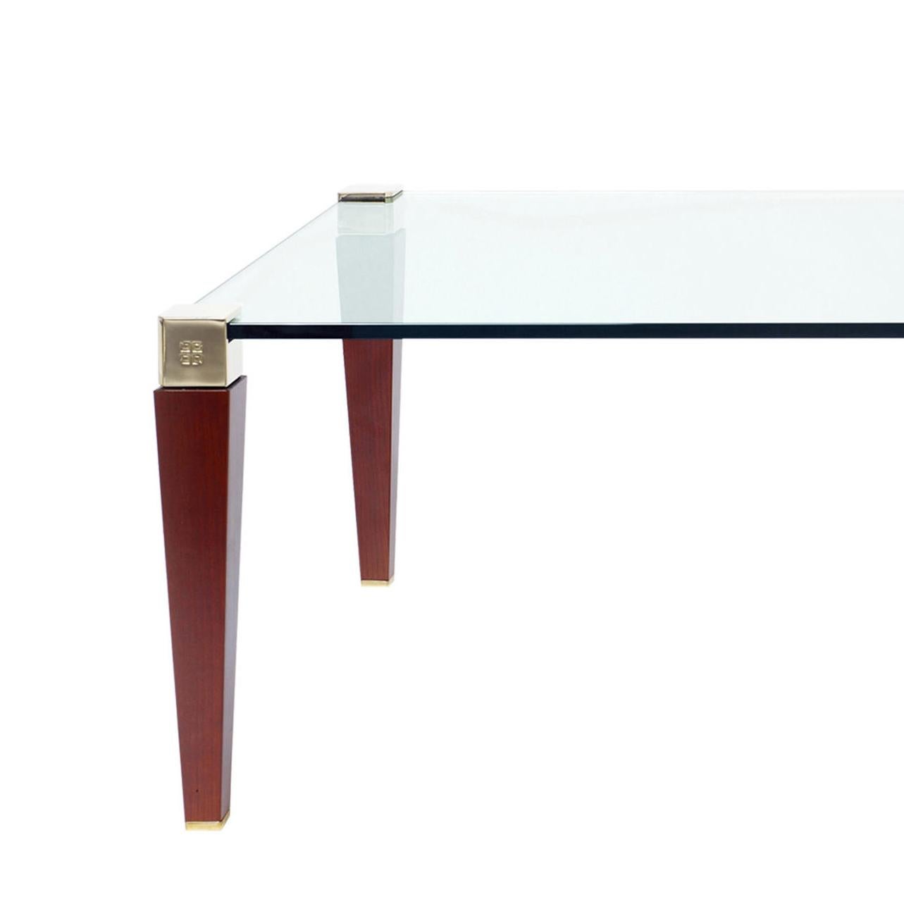 Designed by Peter Ghyczy 1995.
Manufactured by Ghyczy (Netherlands)

The T56/2 is the bigger version of the T56 series. The table legs are made of solid wood and casted parts which clamp the glass. The glass has a thickness of 15 mm. The wood is