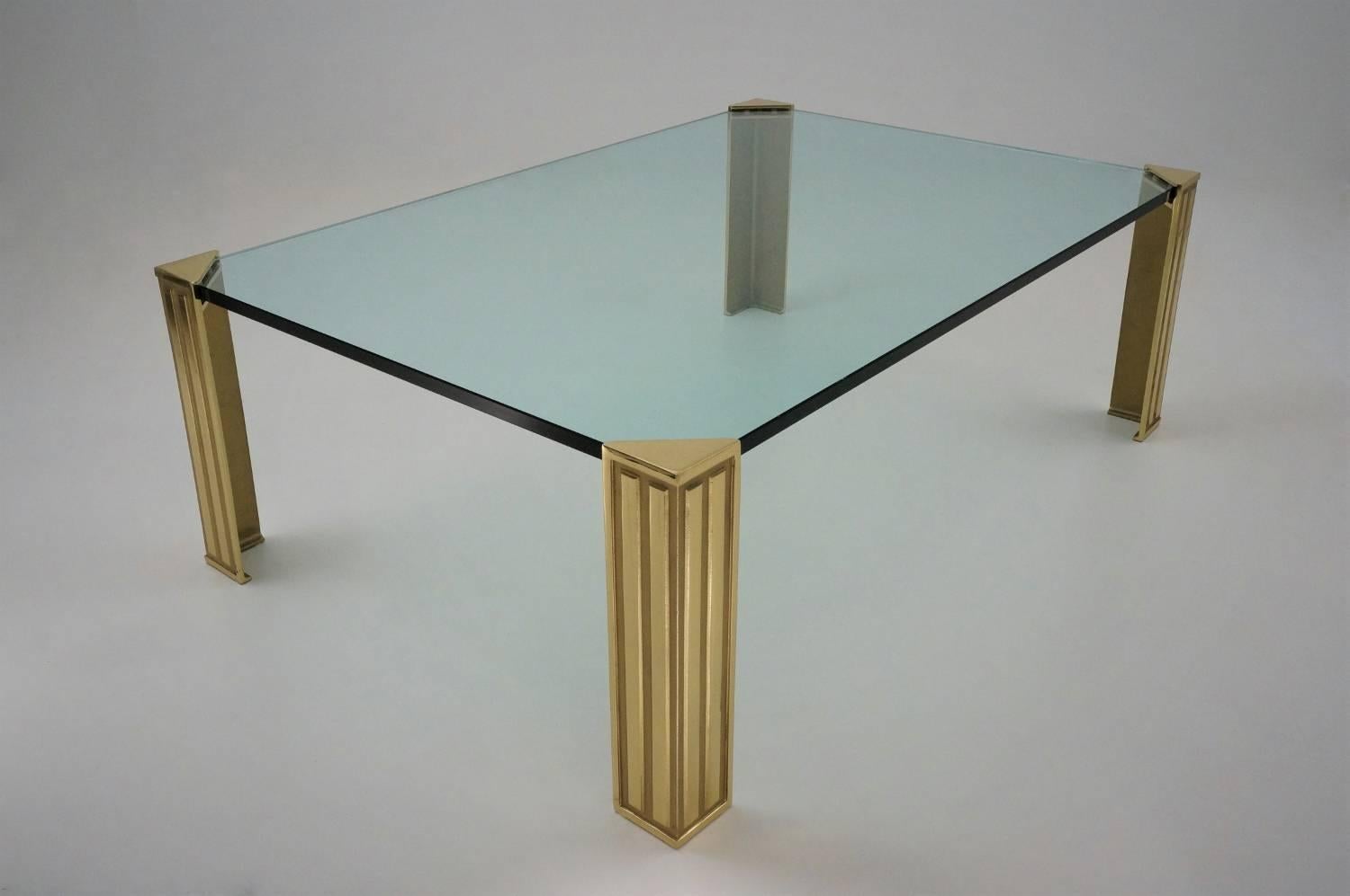 Peter Ghyczy coffee table, frameless design with brass legs and quality glass top, circa 1990s, Dutch.

This coffee table has been gently cleaned while respecting the vintage patina, it is ready to use.

Peter Ghyczy is one of the pioneers of
