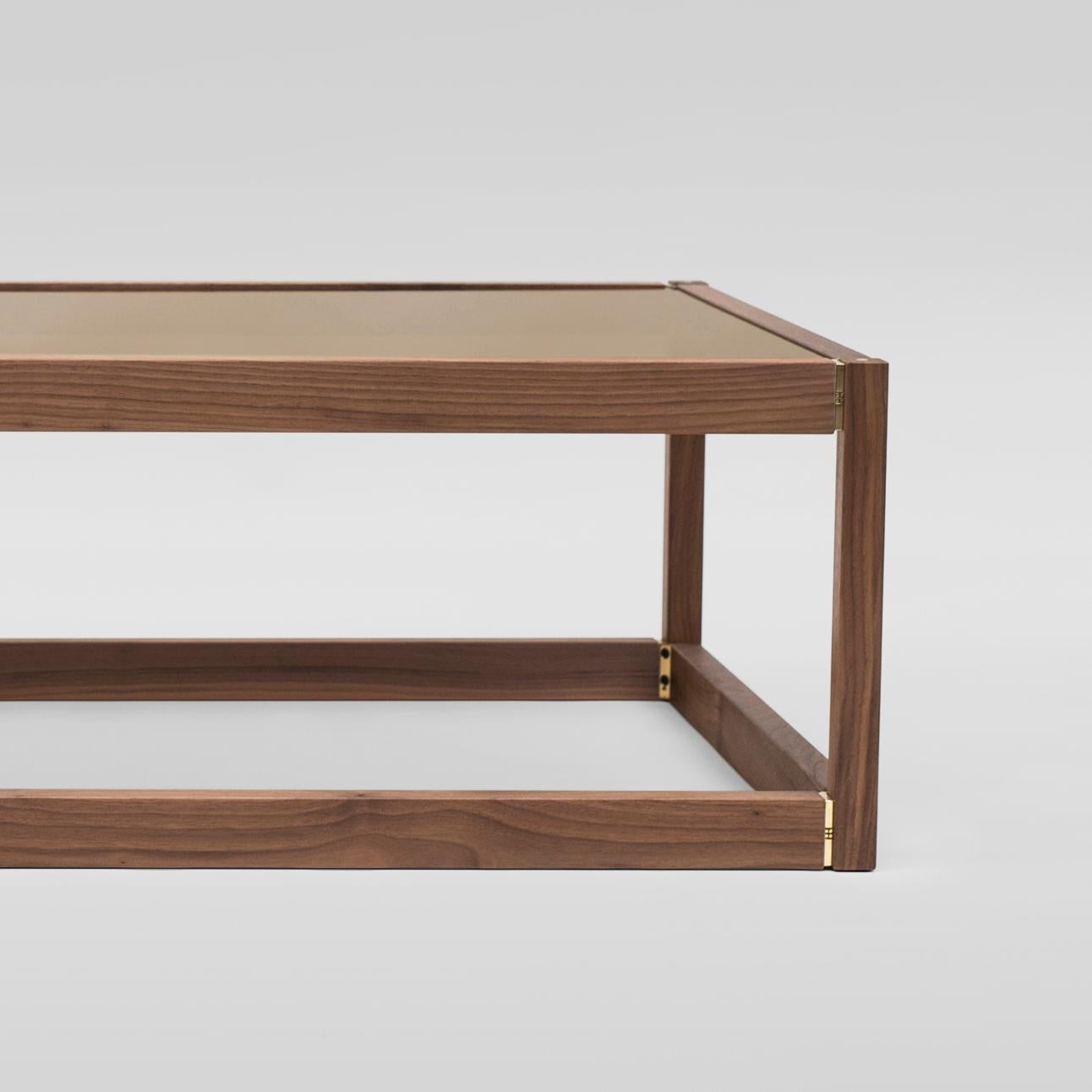 Contemporary coffee table designed by Peter Ghyczy.
Manufactured by Ghyczy, (Netherlands)

This furniture tells an intriguing dialogue between history and modernity. The joints are an evolution of a design by Peter Ghyczy from begin of the 1970s.
