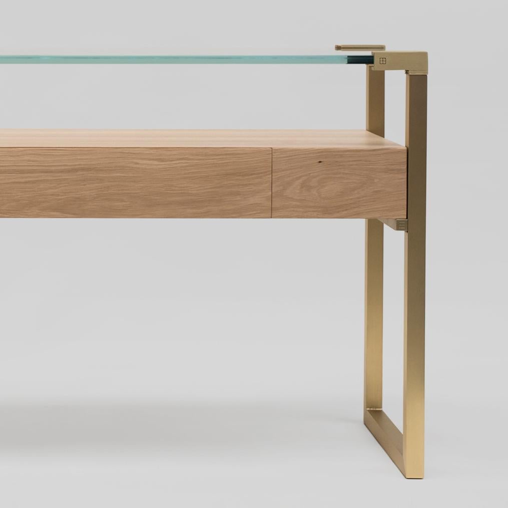 Contemporary console table designed by Peter Ghyczy in 2009.
Manufactured by Ghyczy (Netherlands)

The twin frames are constructed of 3 × 3 square tubes and secured to the tabletop by cast metal details. Special feature is a solid wooden drawer. The