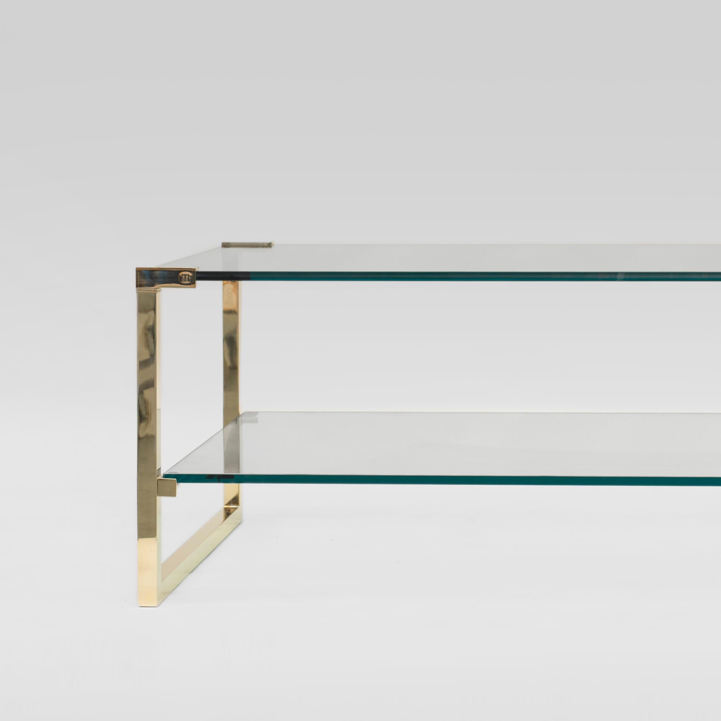 Table designed by Peter Ghyczy.
Manufactured by Ghyczy (Netherlands)

The twin frames are constructed of 3 × 3 square tubes and secured to the tabletop by cast metal details. The strong construction makes this table versatile, fitting every
