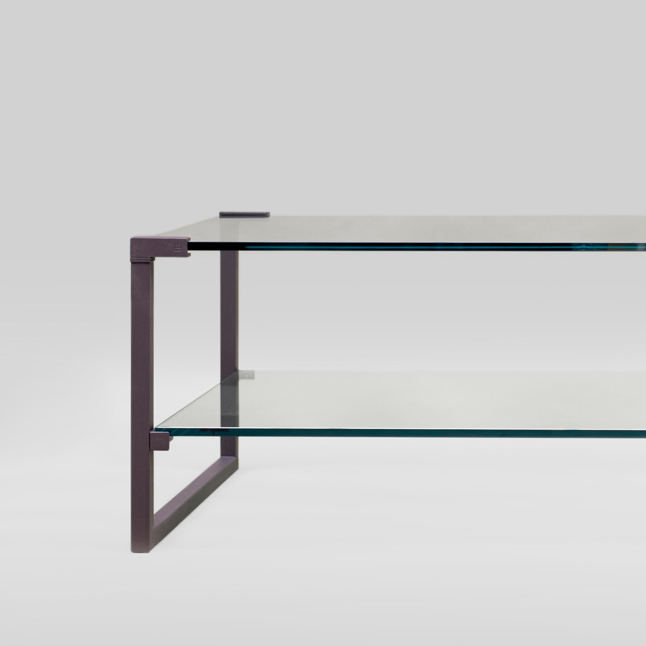 Table designed by Peter Ghyczy.
Manufactured by Ghyczy (Netherlands)

The twin frames are constructed of 3 × 3 square tubes and secured to the tabletop by cast metal details. The strong construction makes this table versatile, fitting every interior