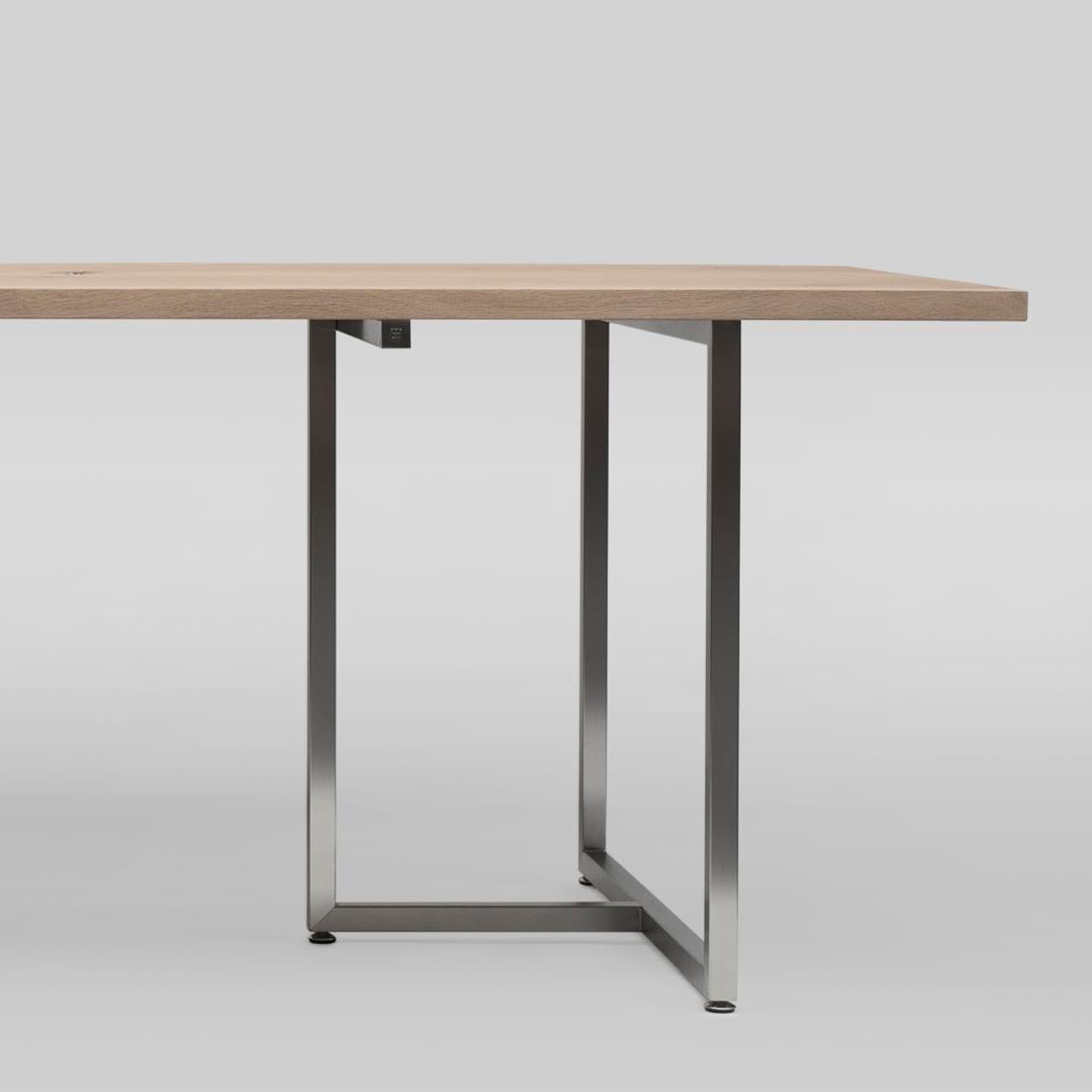 Table designed by Peter Ghyczy.
Manufactured by Ghyczy (Netherlands)

A markedly signature piece, this design features two solid, wooden planks that appear to be floating. The beauty behind this design is its capacity to withstand