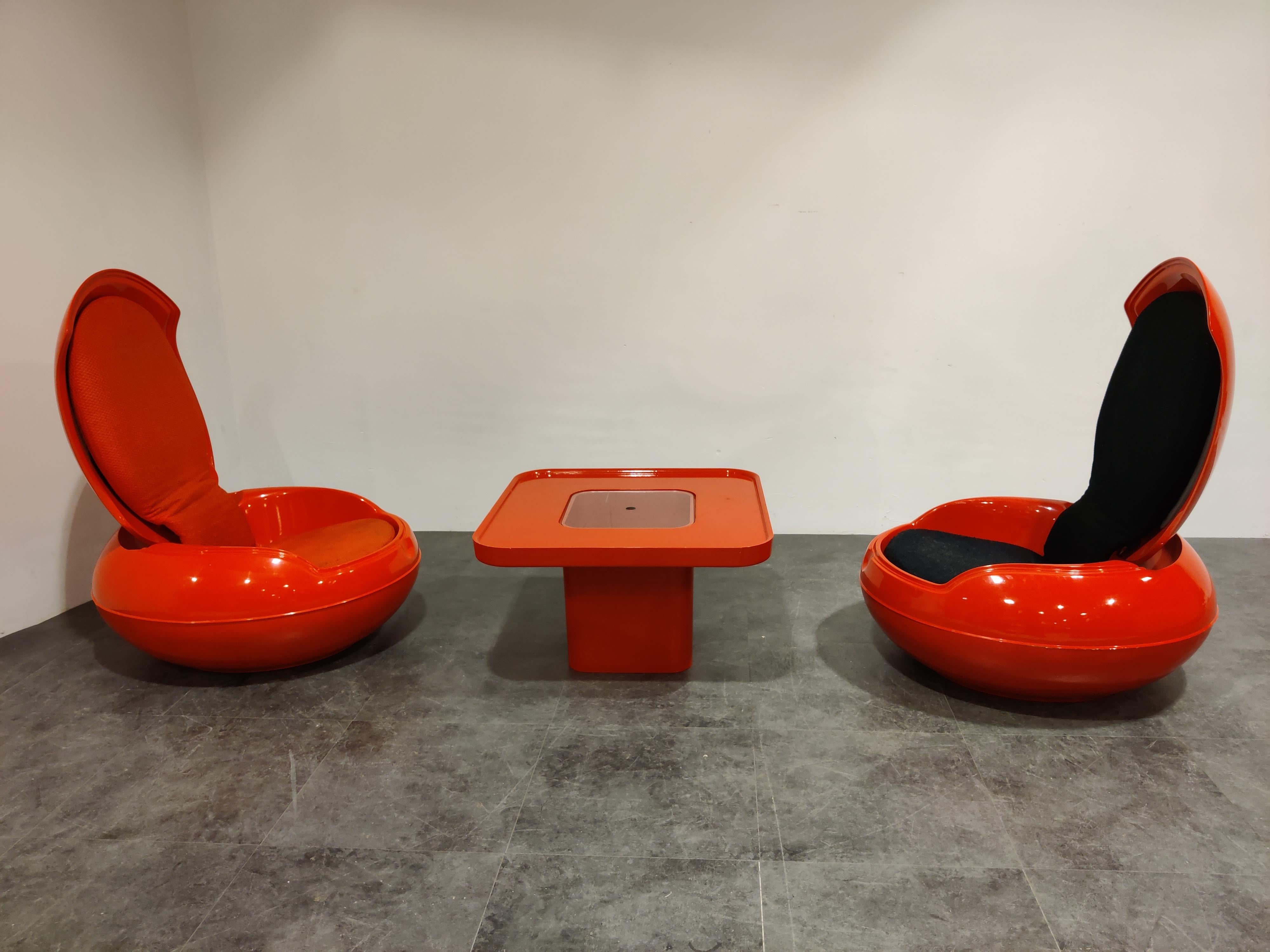 Rare set of midcentury garden egg chairs with table designed by Peter Ghyczy in 1968.

These remarkable chairs are made from fiberglass shelss with fabric.

1960s - Germany

Good original condition with minor wear.

Dimensions:

Height