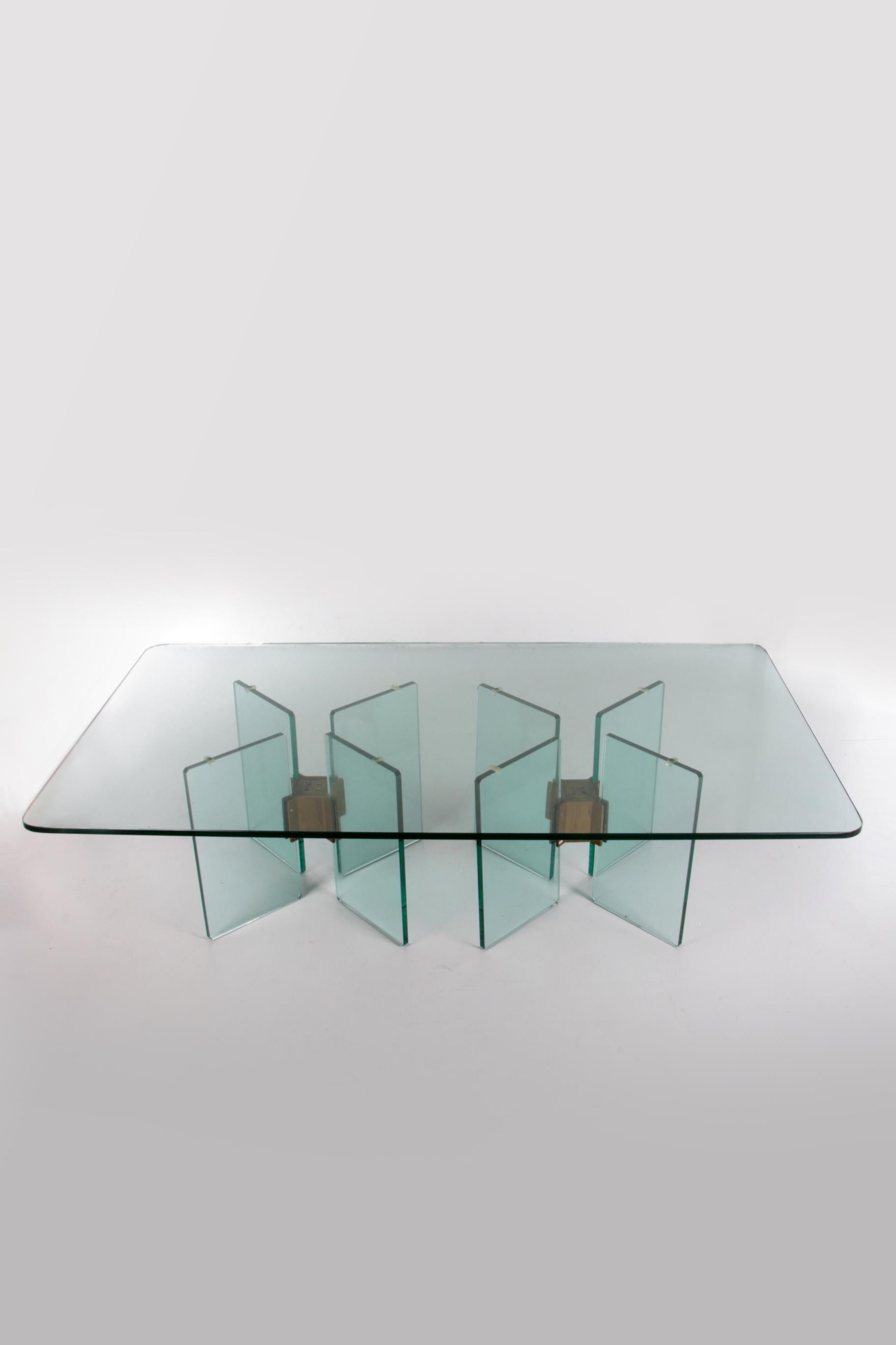 Peter Ghyczy Glass coffee table model T15


Elegant T15 coffee table by Peter Ghyczy with brass with glass legs and a thick glass top.

With very special x glass feet.

Knowledge of constructions striving to balance originality and craftsmanship are