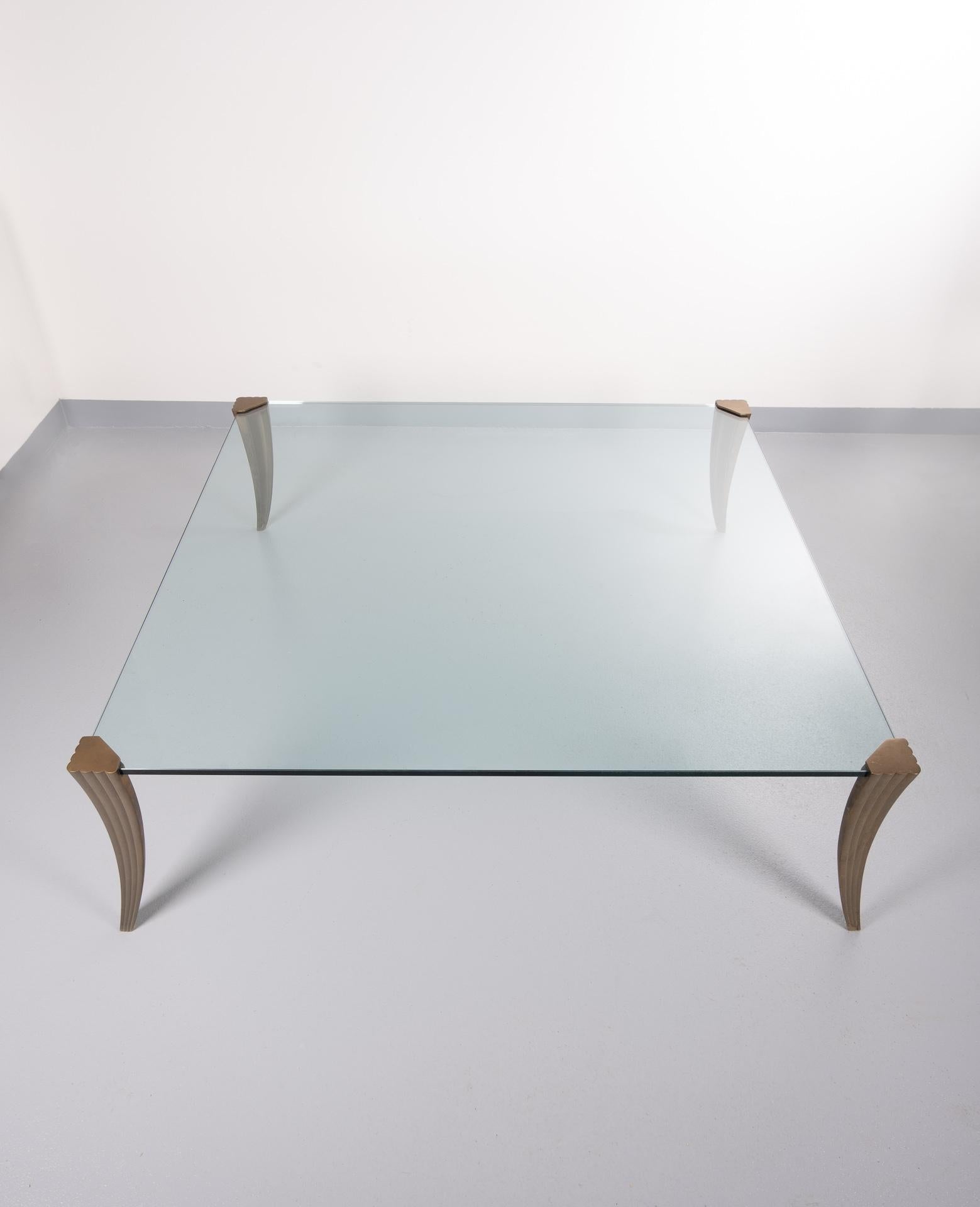 Superb large coffee table by Peter Ghyczy, thick cut glass top on cast bronze legs.
Very rare model. Pioneer series looks like the glass top is floating. Very good condition.
