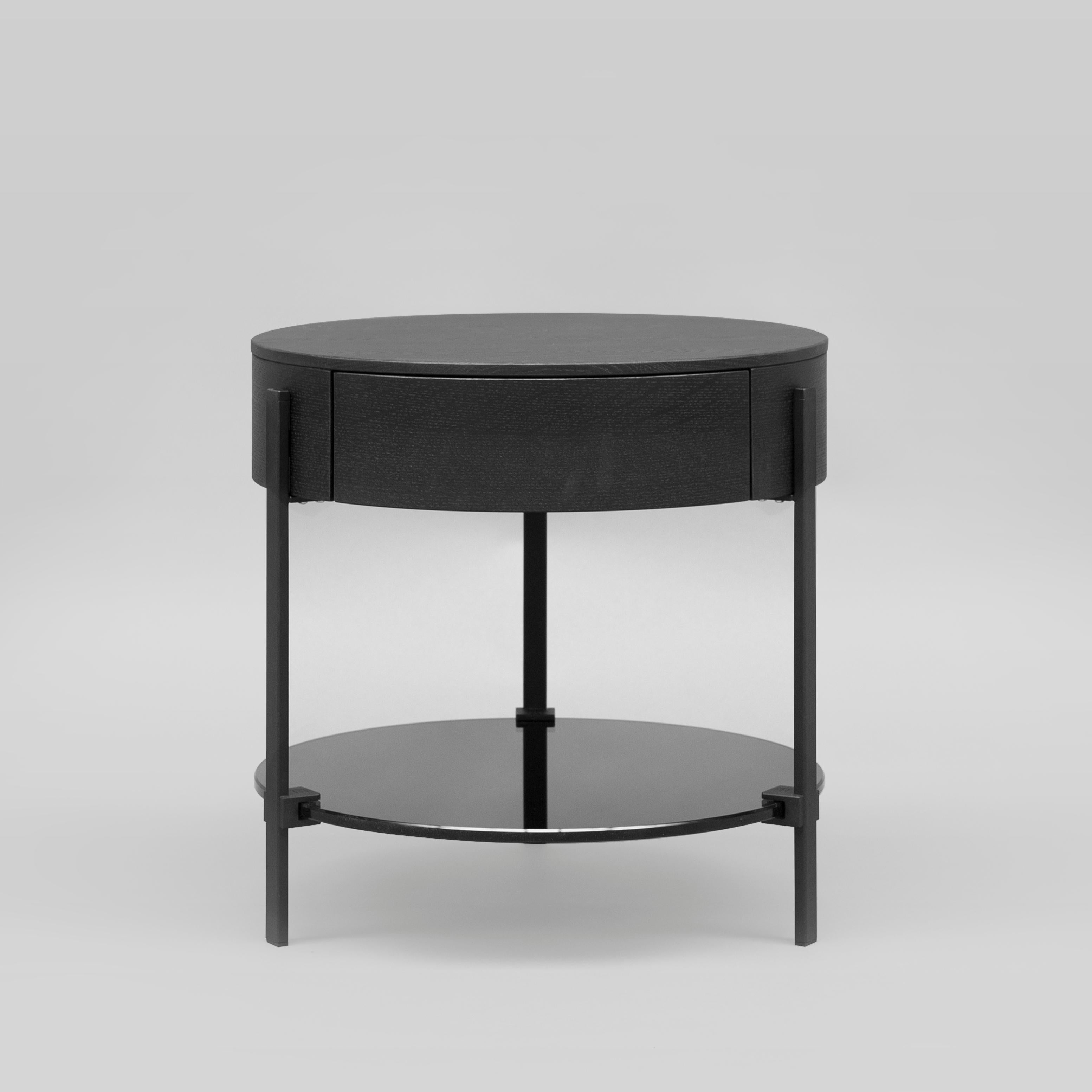 Side table designed by Peter Ghyczy.
Manufactured by Ghyczy (Netherlands)

The T79 is versatile as it is modest. Three stainless steel legs are secured to the glass top by cast metal details. To be ordered in different heights and arranged as