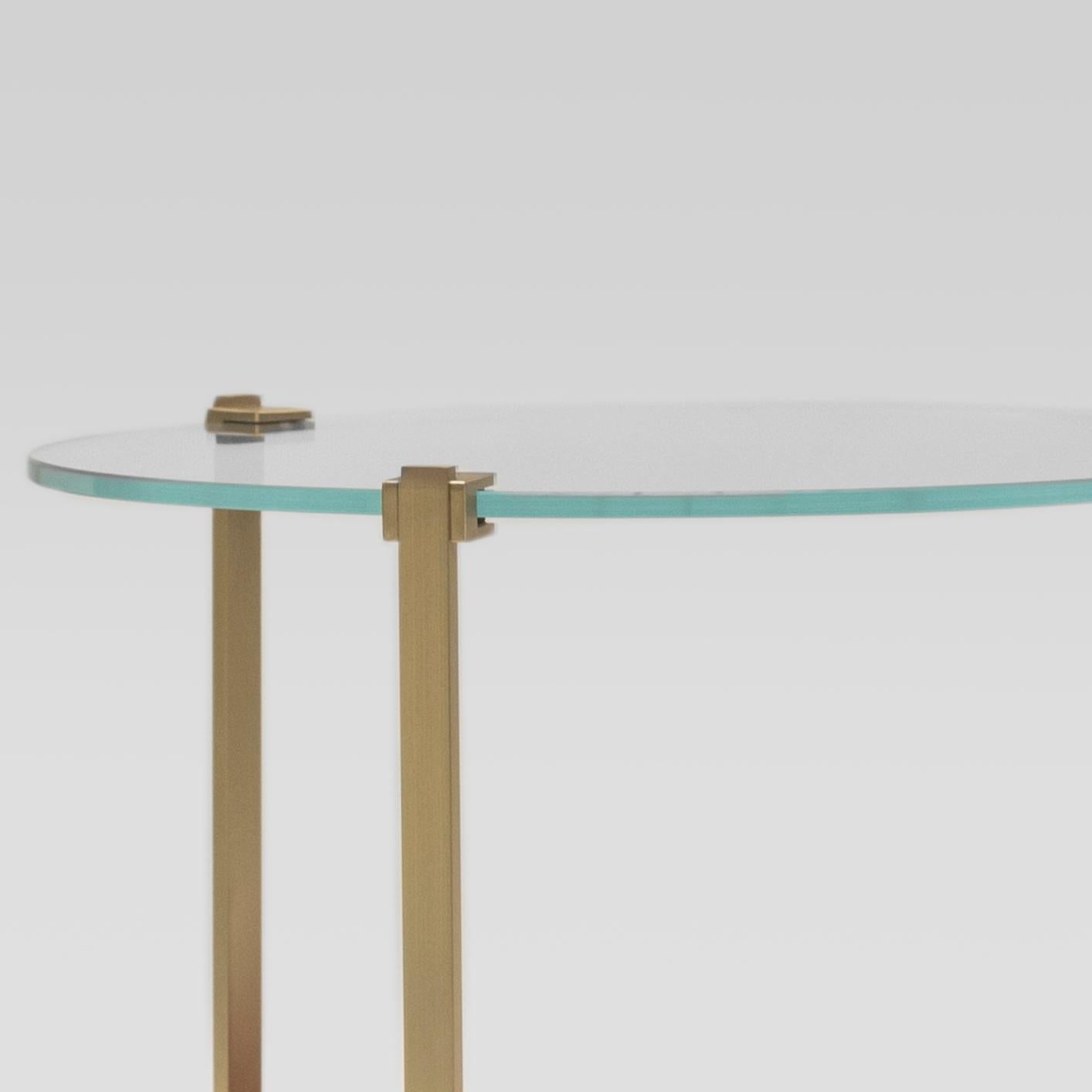 Contemporary Sidetable designed by Peter Ghyczy.
Manufactured by Ghyczy (Netherlands)

The T79 is versatile as it is modest. Three stainless steel legs are secured to the glass top by cast metal details. To be ordered in different heights and