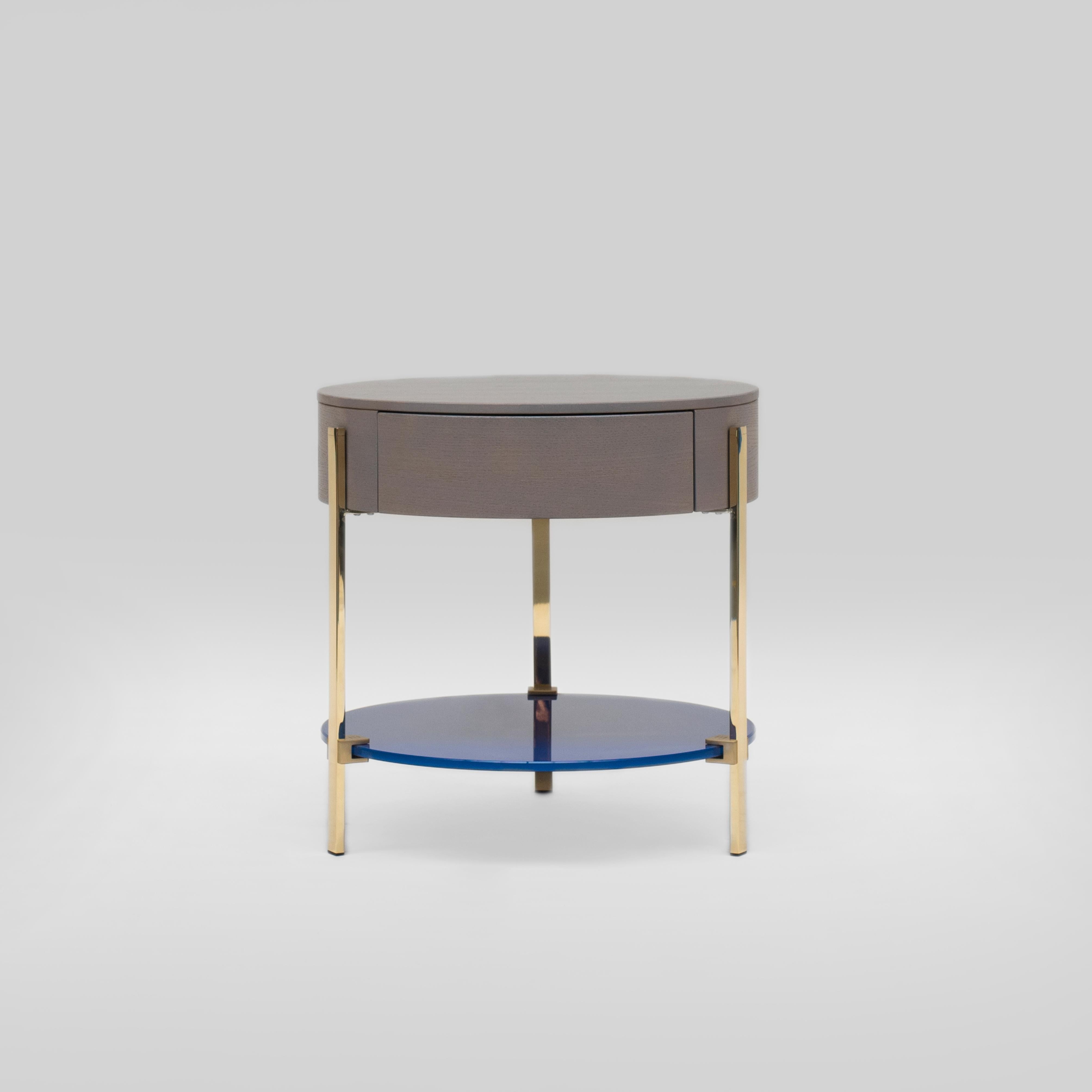 Side table designed by Peter Ghyczy.
Manufactured by Ghyczy (Netherlands)

The T79 is versatile as it is modest. Three stainless steel legs are secured to the glass top by cast metal details. To be ordered in different heights and arranged as