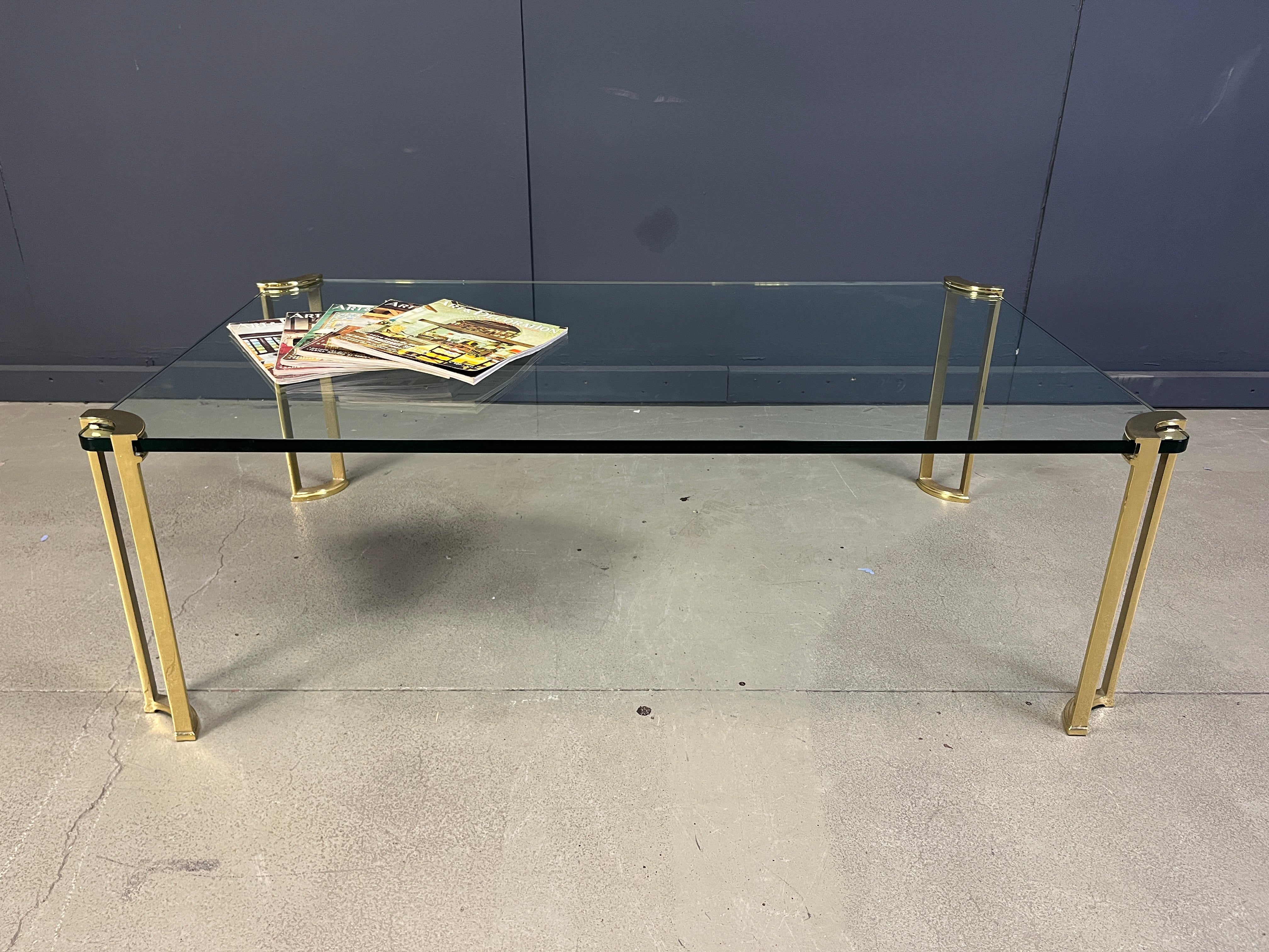 Peter Ghyczy style coffee table in brass and glass For Sale