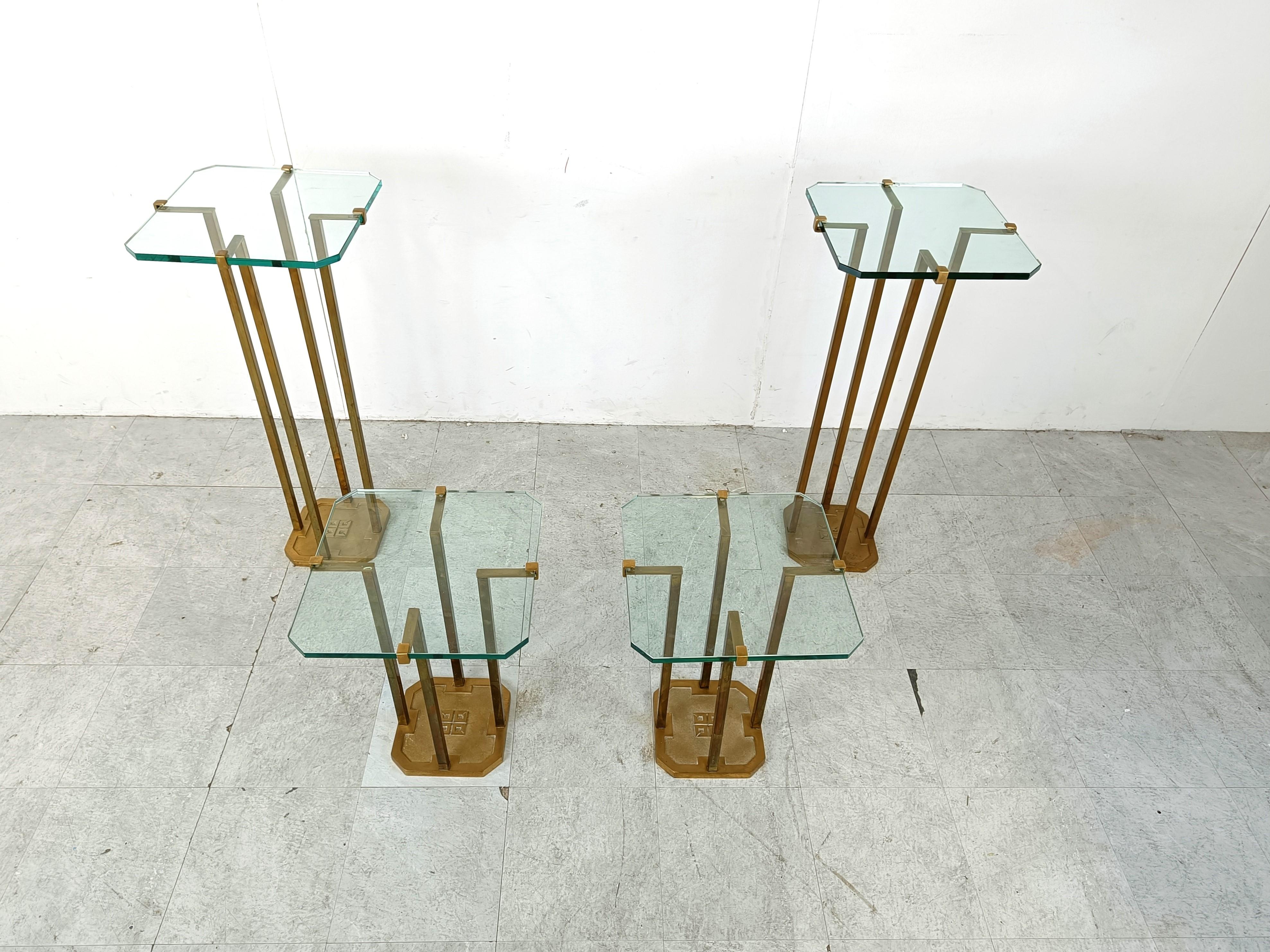 Very rare set of model T18 side tables made from cast brass legs designed by Peter Ghyczy.

Beautiful design that holds the glass in a unique way. 

Thick clear glass table top.

Its very unique to find a set like this with two higher and 2 normal