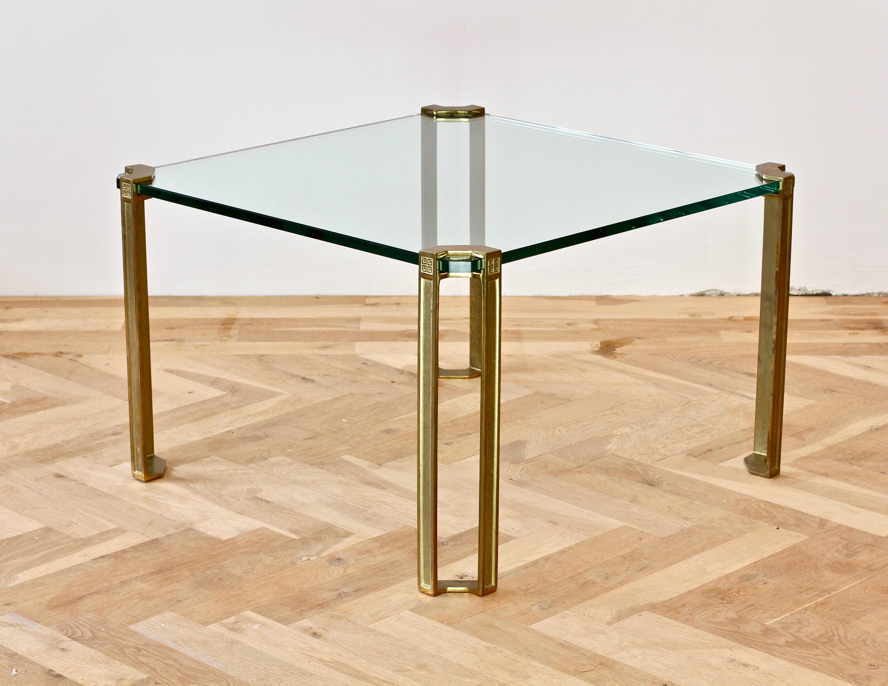 Peter Ghyczy 'T24 Pioneer' square end or coffee table in cast brass. Designed by Hungarian born designer Peter Ghyczy circa 1975 featuring his pioneering casting techniques and way of suspending glass and metal.

Thick 15mm clear glass table top.