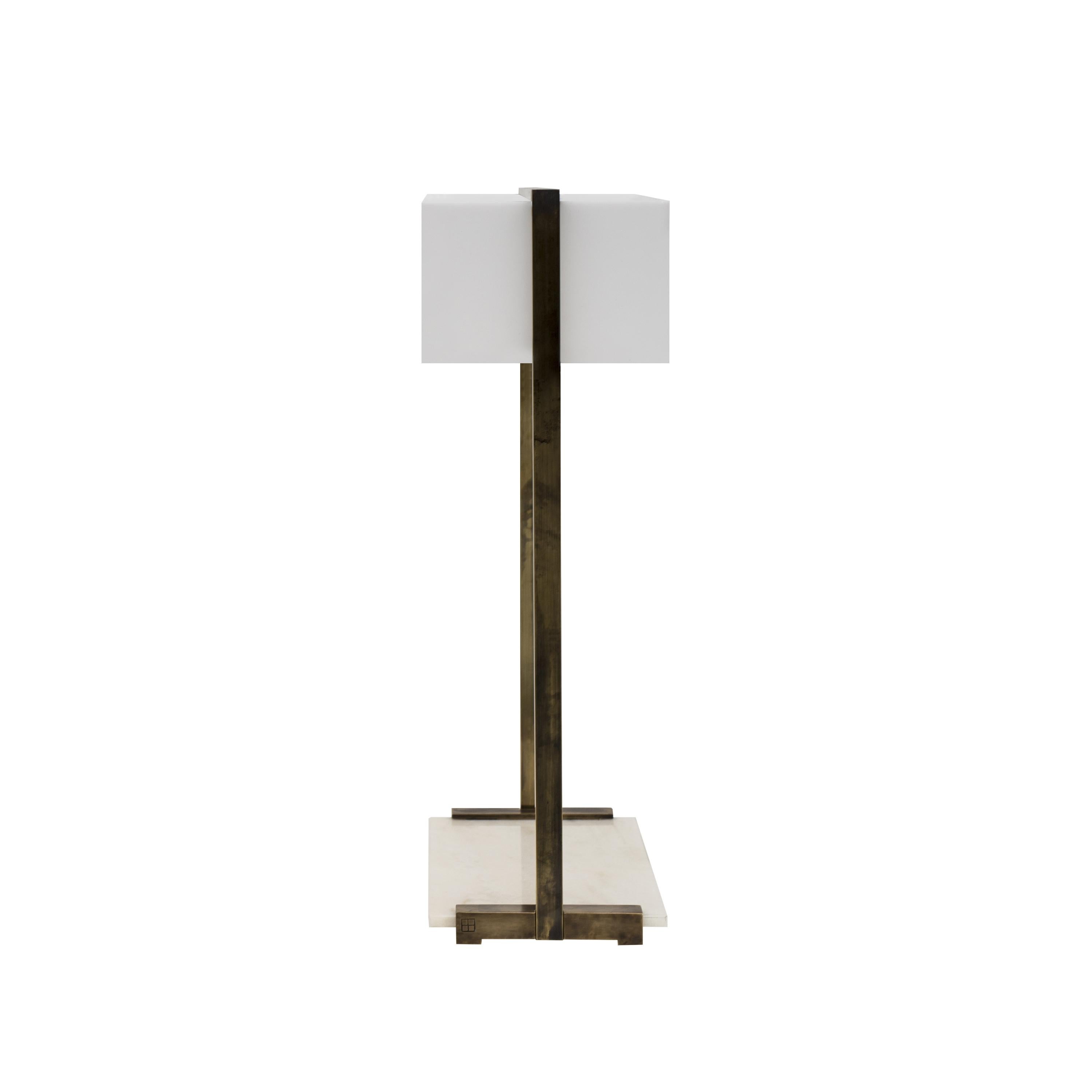 Table Lamp designed by Peter Ghyczy in 2006.
Manufactured by Ghyczy (Netherlands)

This table lamp is a multi-tasker. The spacious construction of high quality metals leaves room for multiple ways of use as a bedside or table lamp or even a display