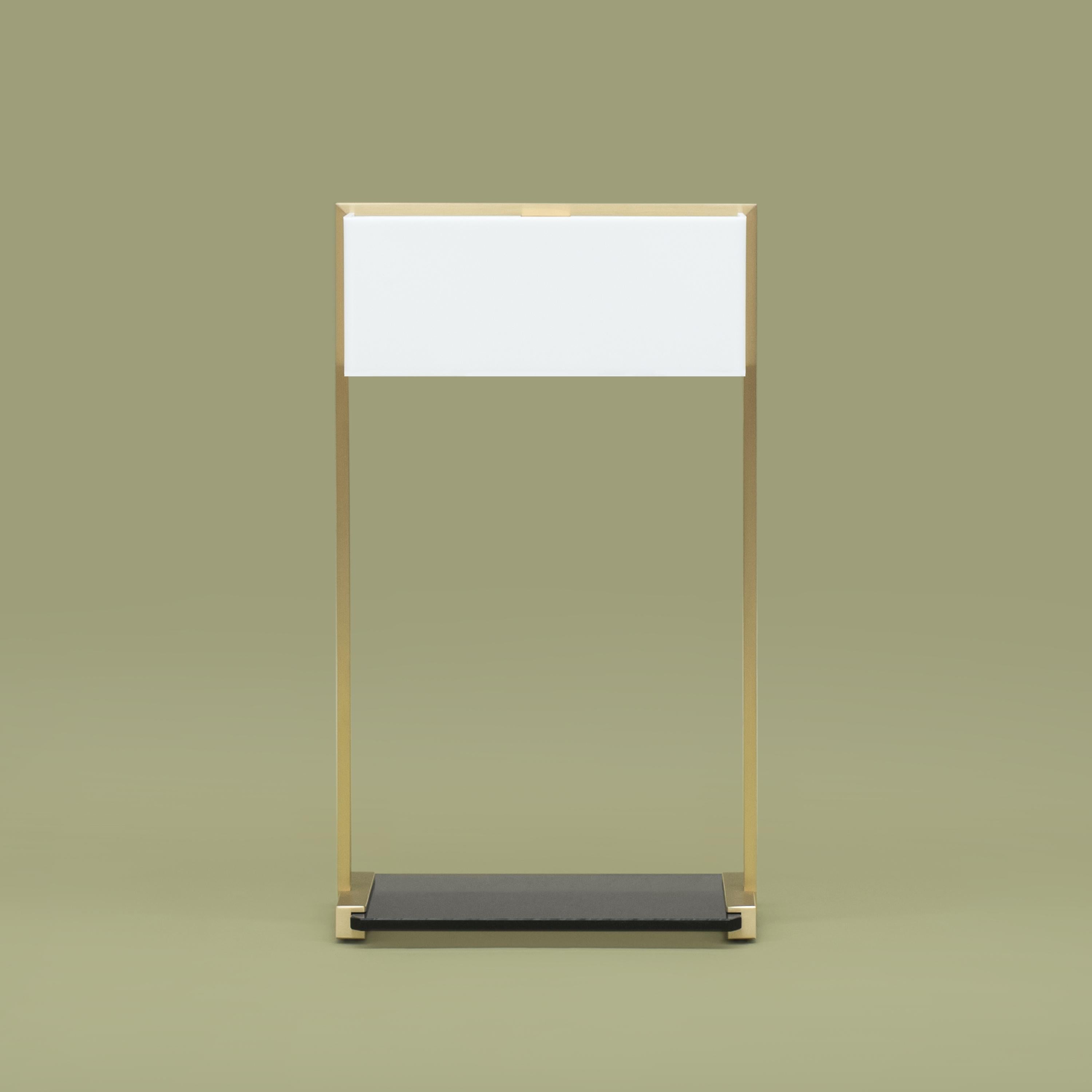 Table lamp designed by Peter Ghyczy in 2006.
Manufactured by Ghyczy, (Netherlands)

This table lamp is a multi-tasker. The spacious construction of high quality metals leaves room for multiple ways of use as a bedside or table lamp or even a