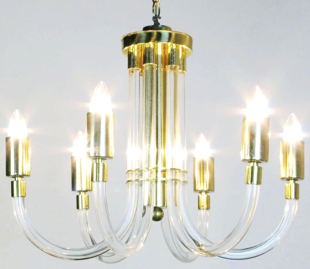 A dramatic use of materials and design, the acrylic arms of this chandelier curve up through the brass double disc to end at the upper most brass caps and bowl. Brass rod with brass ball end centers the column formed by the acrylic arms.