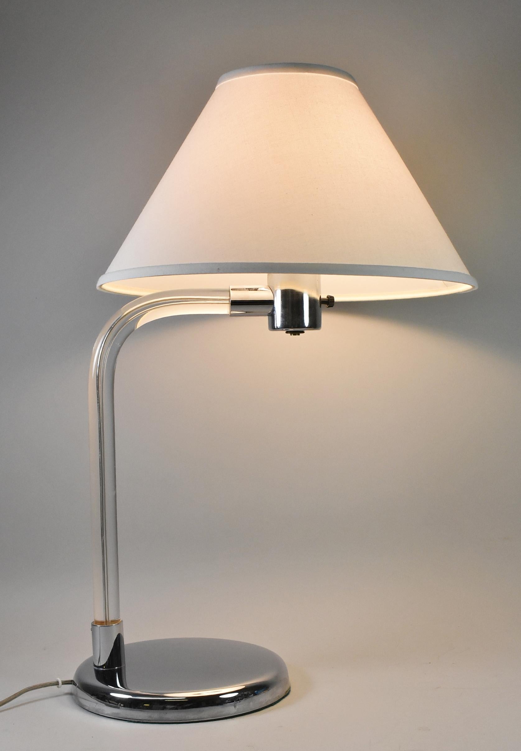 This beautiful mid century table lamp was designed by Peter Hamburger for Knoll. The gooseneck Lucite stem is capped with chrome hardware and base. The base is 8