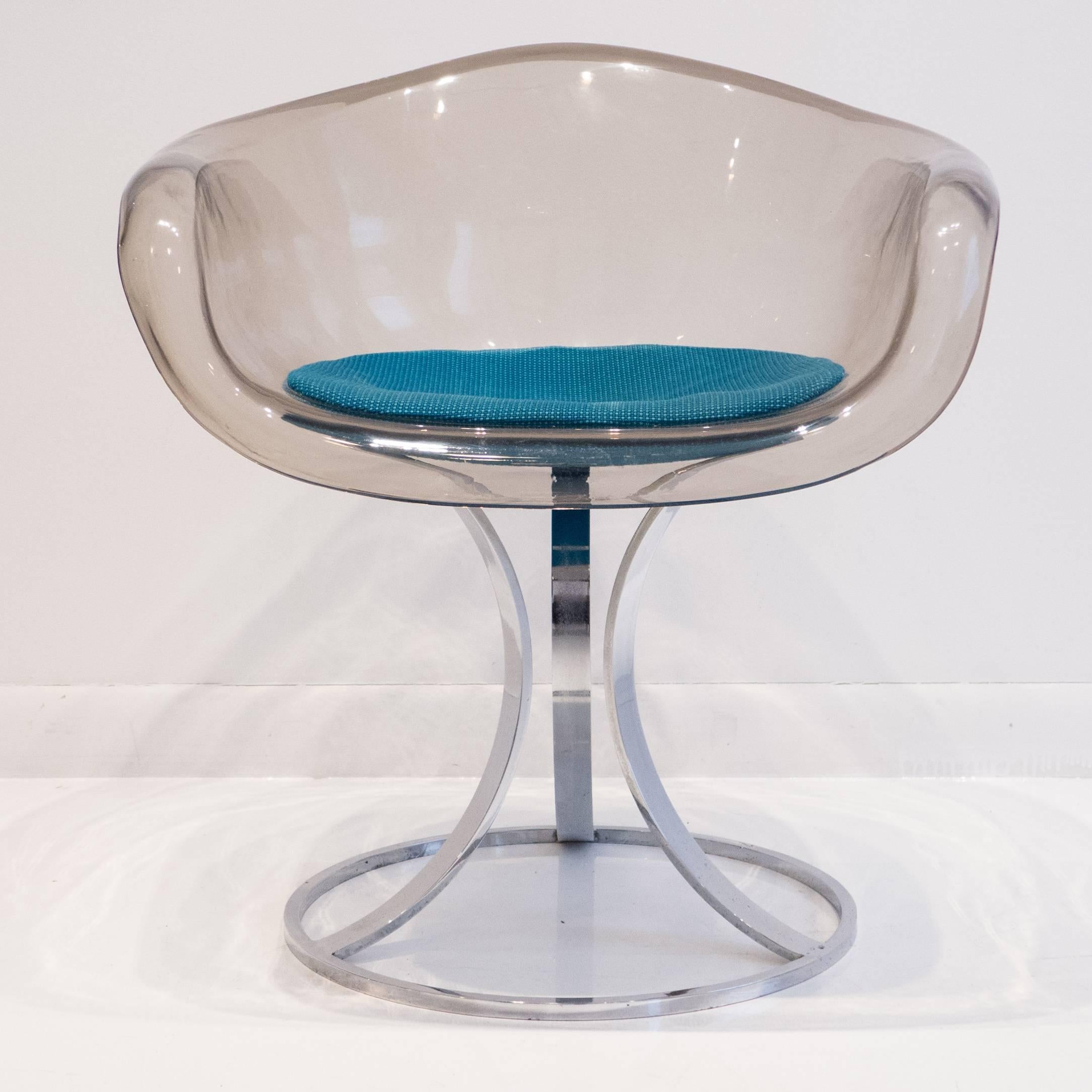 Interesting tulip-shaped acrylic and chrome armchair by British designer Peter Hoyte, produced circa 1968. With original upholstery, which is applied underneath the outside of the chair, as well as in the seat. Retains original metal tag.  Two