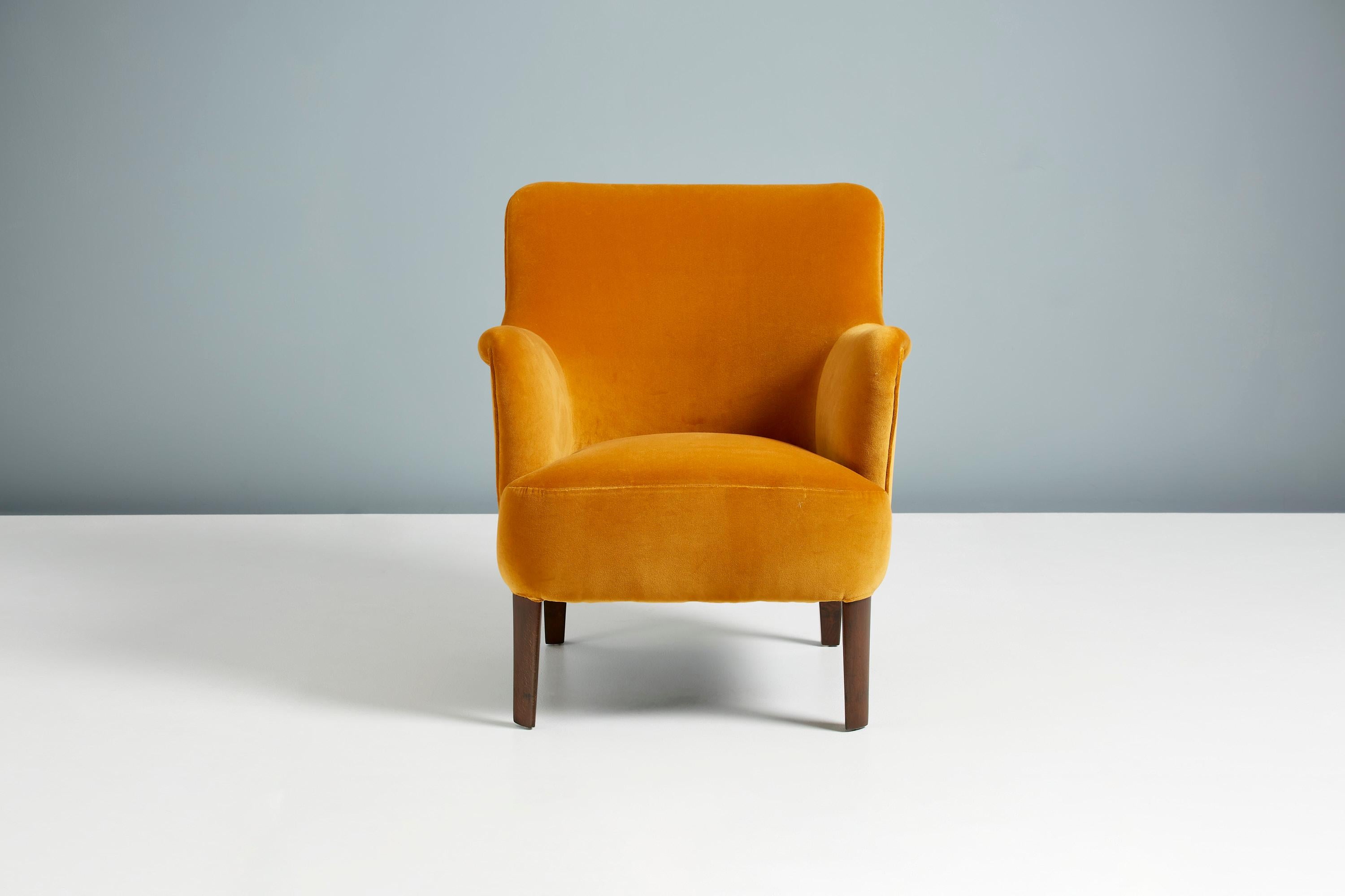 Peter Hvidt

Model 1748 lounge chair, circa 1940s

This elegant low-back lounge chair was produced by Fritz Hansen in Denmark in the late 1940s by master-designer Peter Hvidt. The beech legs have been walnut-stained and has been completely