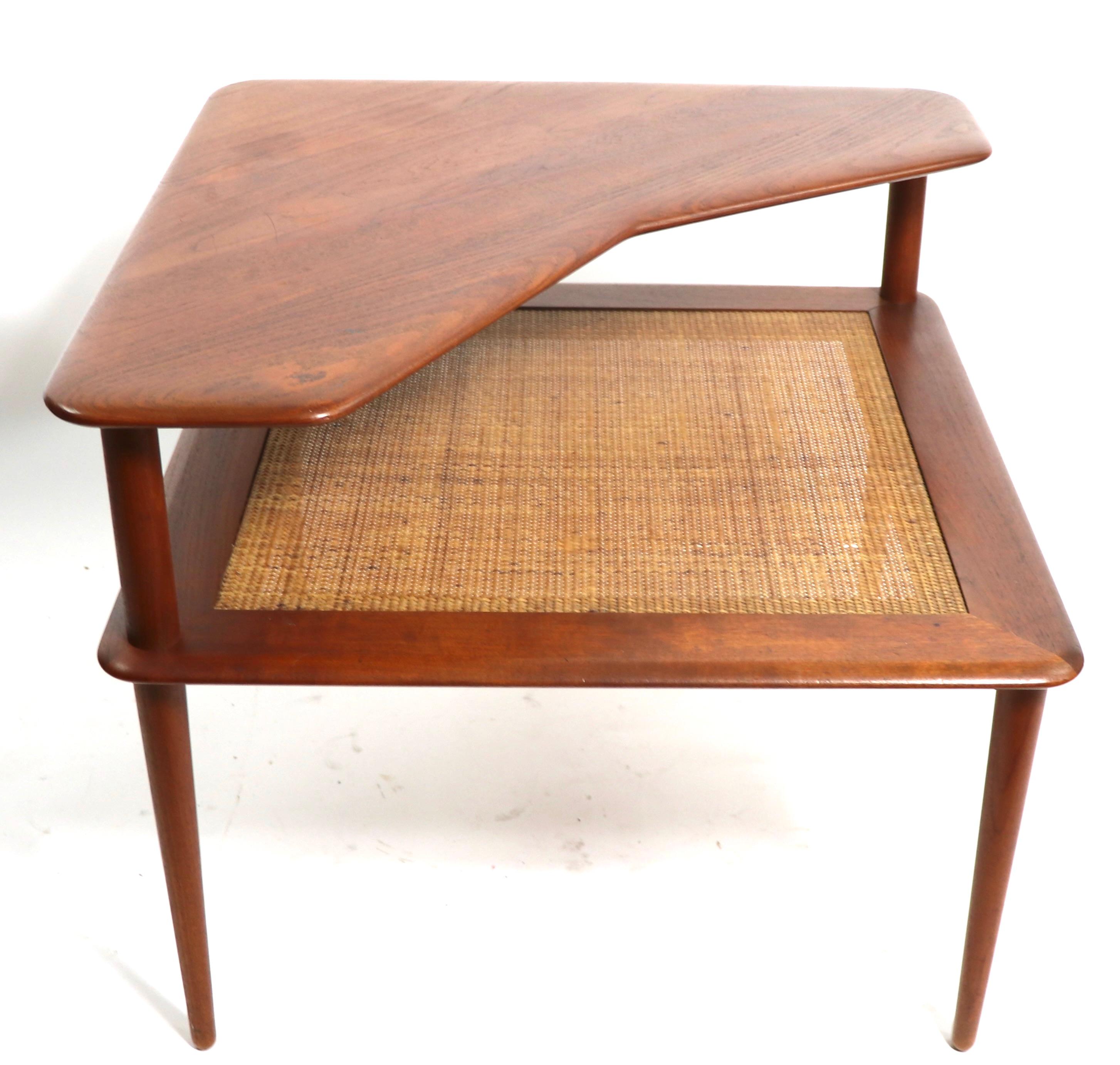 Iconic Danish Modern furniture, designed by Peter Hvidt and Olga Moregaard, made by France and Son, imported and retailed by John Stuart. This example is in very good estate vintage estate condition, showing only light cosmetic wear, normal and