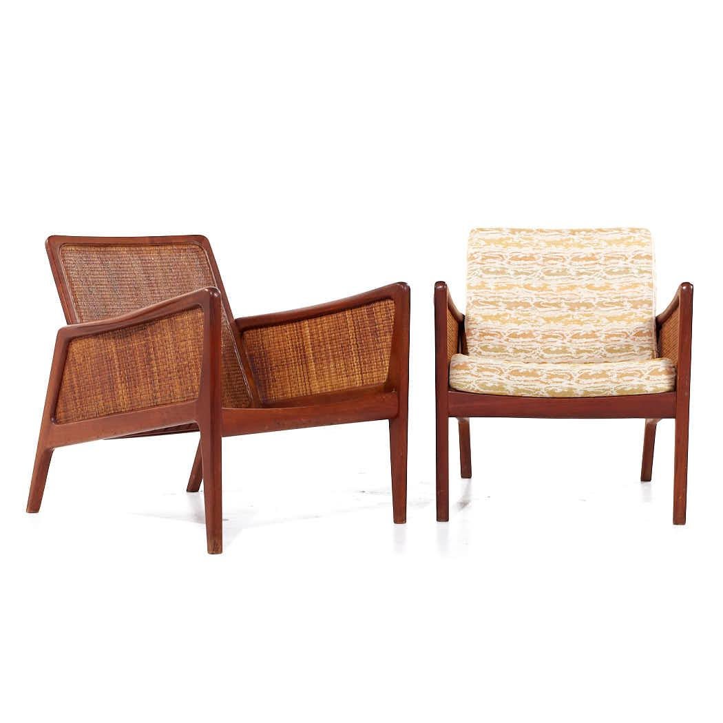 Peter Hvidt and Orla Mølgaard Nielsen Mid Century Teak and Rattan Lounge Chairs - Pair

Each chair measures: 25.5 wide x 31 deep x 27.5 high, with a seat height of 15 and arm height/chair clearance 23 inches

All pieces of furniture can be had in