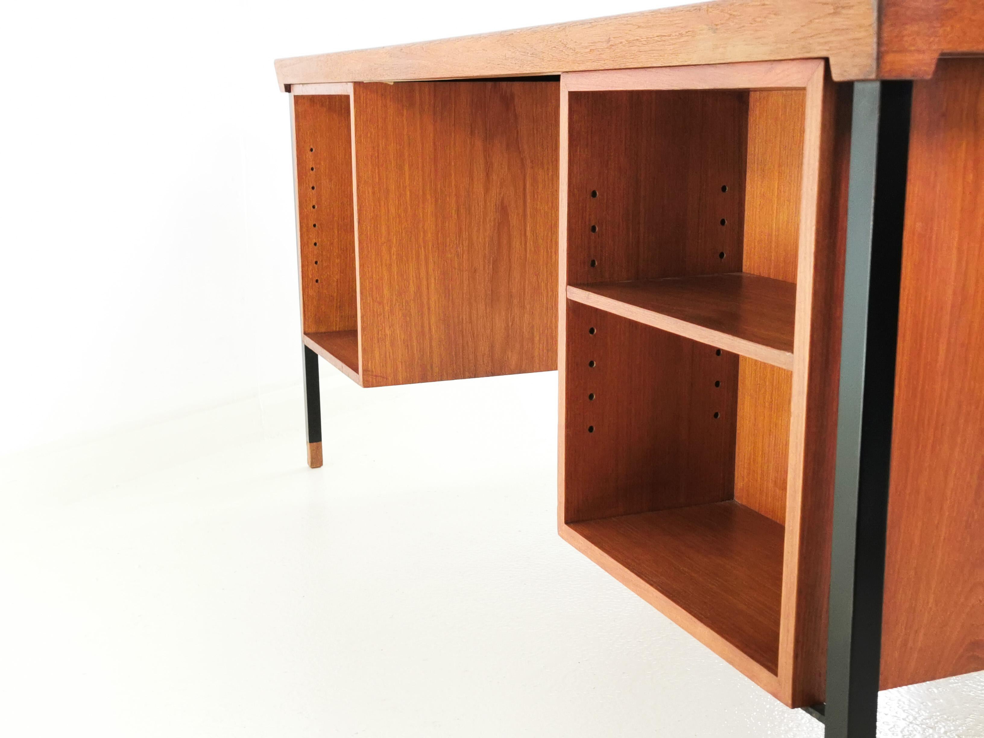 A teak desk designed by Peter Hvidt and Orla Molgaard-Nielsen for Soborg Mobelfabrik, circa 1960s made in Denmark to a Scandinavian design. The desk has six drawers with small removable organisation trays, two of the trays slide out entirely. The