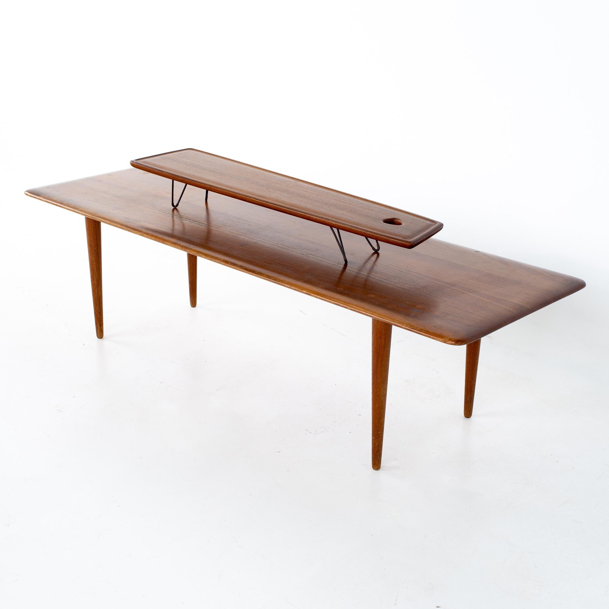 Peter Hvidt and Orla Molgaard Nielsen mid century teak coffee table.
Coffee table measures: 60 wide x 20 deep x 15.75 inches high
Smaller table measures: 37 wide x 8 deep x 4.5 inches high

All pieces of furniture can be had in what we call