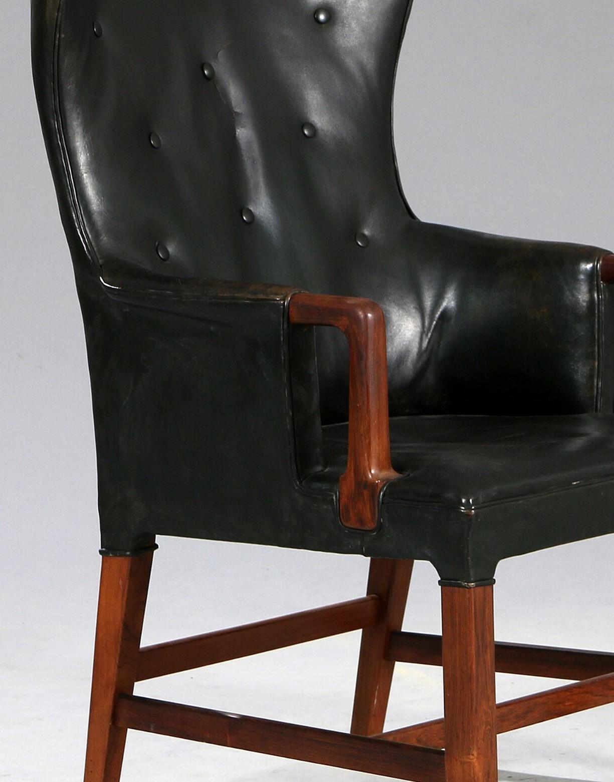 Danish Peter Hvidt: Armchair of Rosewood and Black Leather circa 1955 For Sale