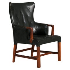 Peter Hvidt: Armchair of Rosewood and Black Leather circa 1955