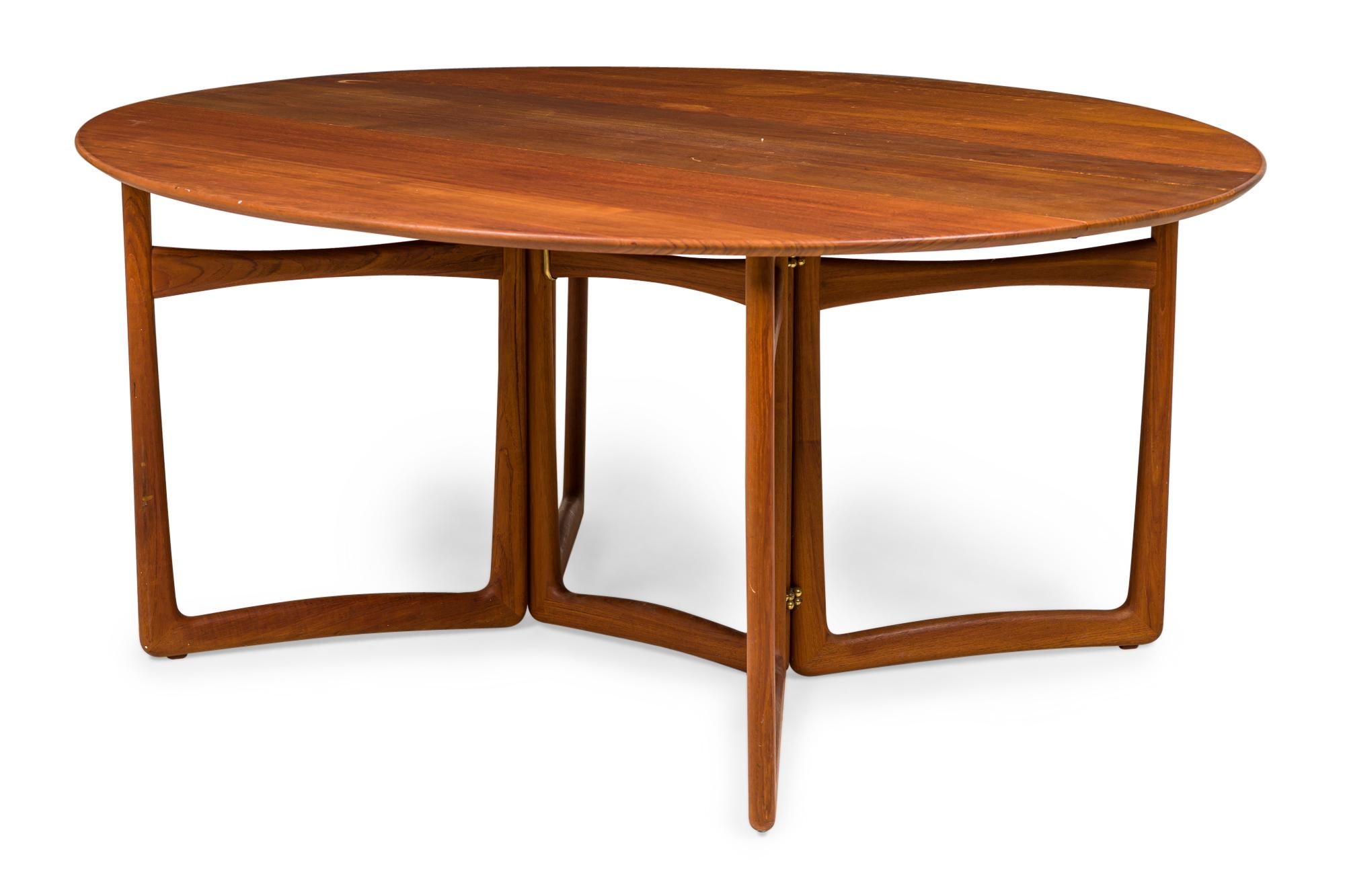 Danish Mid-Century wooden console / dining table with a rectangular console profile when closed, with two demilune drop leaves supported by four gate legs to create a circular dining table when open. (PETER HVIDT)
