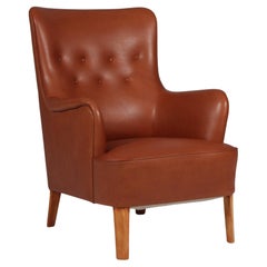 Peter Hvidt Early Lounge Chair in full grain aniline leather.