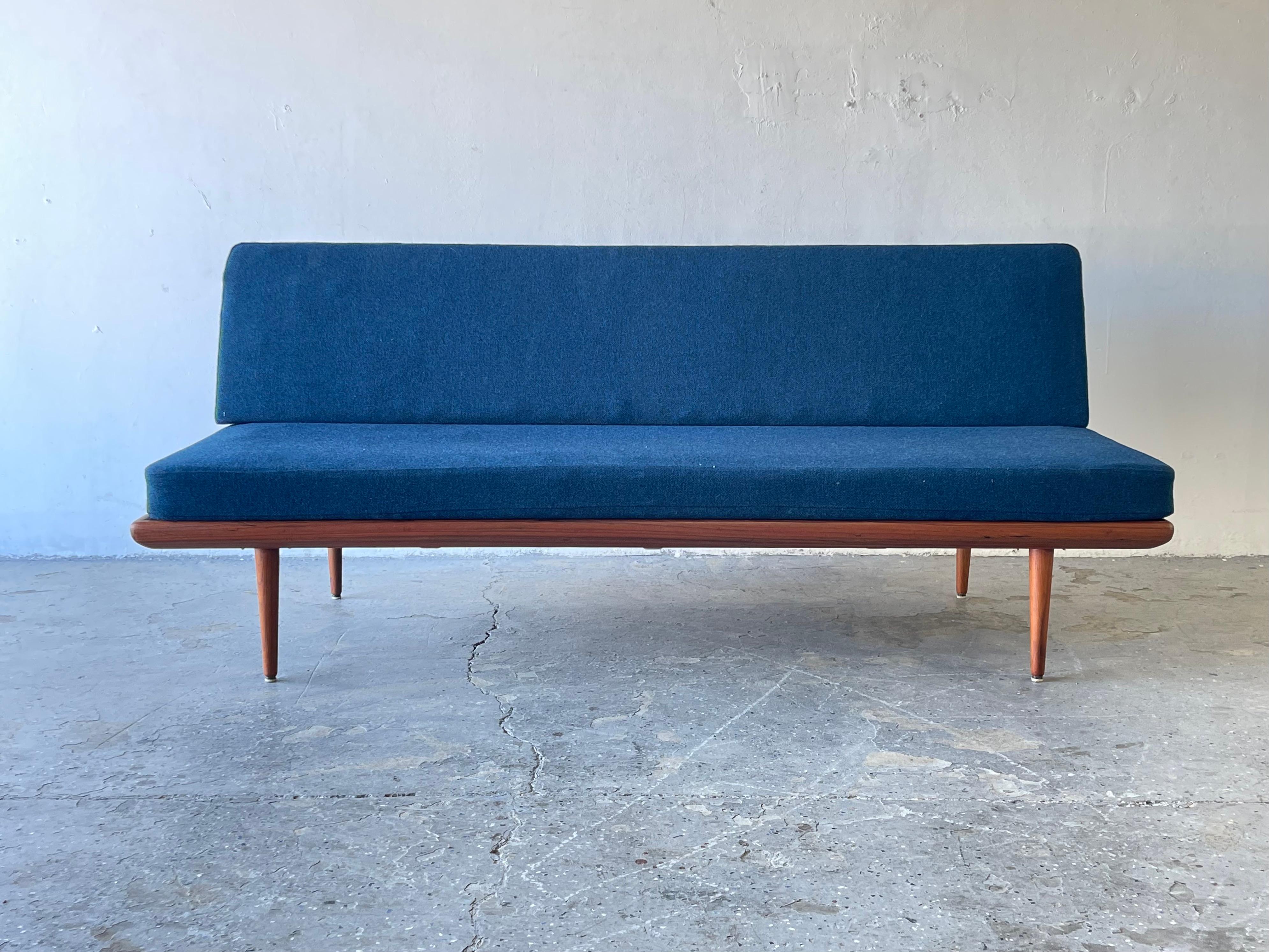 Beautiful sleek Mid-century design. Original blue wool upholstery and spring cushions with Danish modern teak wooden frame. This sofa would look great as is with any mid century modern, Danish or Contemporary modern home.

 Upholstery is in